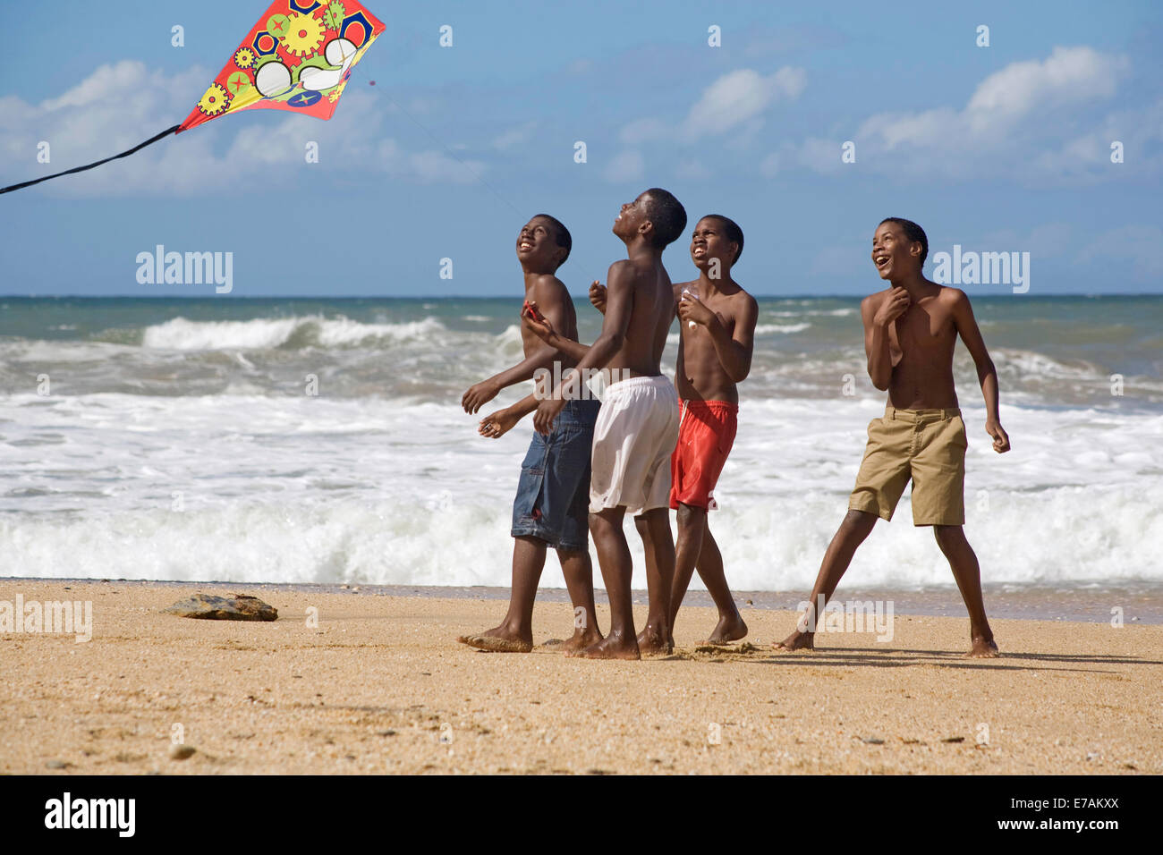 Boys kiteflying at Easter on the beach at Blanchisseuse Stock Photo
