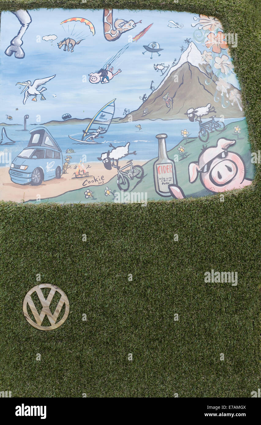 Eco transporter van covered in Astro turf and with wooden Volkswagen Badge and grill Stock Photo
