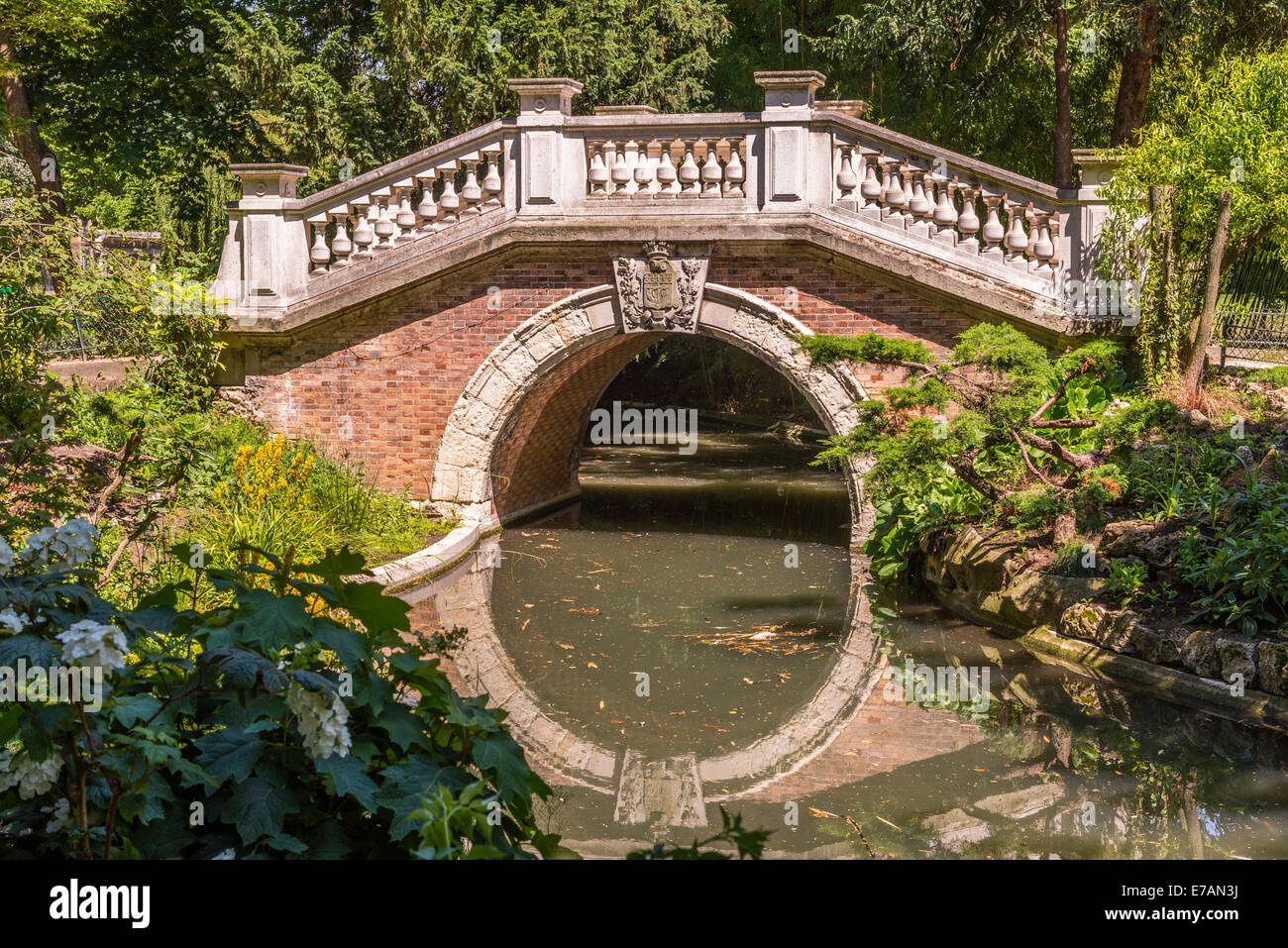 A bridge over a pond in the Park Monceau Paris France. Stock Photo