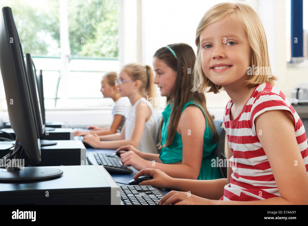 Group Of Female Elementary School Children In Computer Class Stock ...