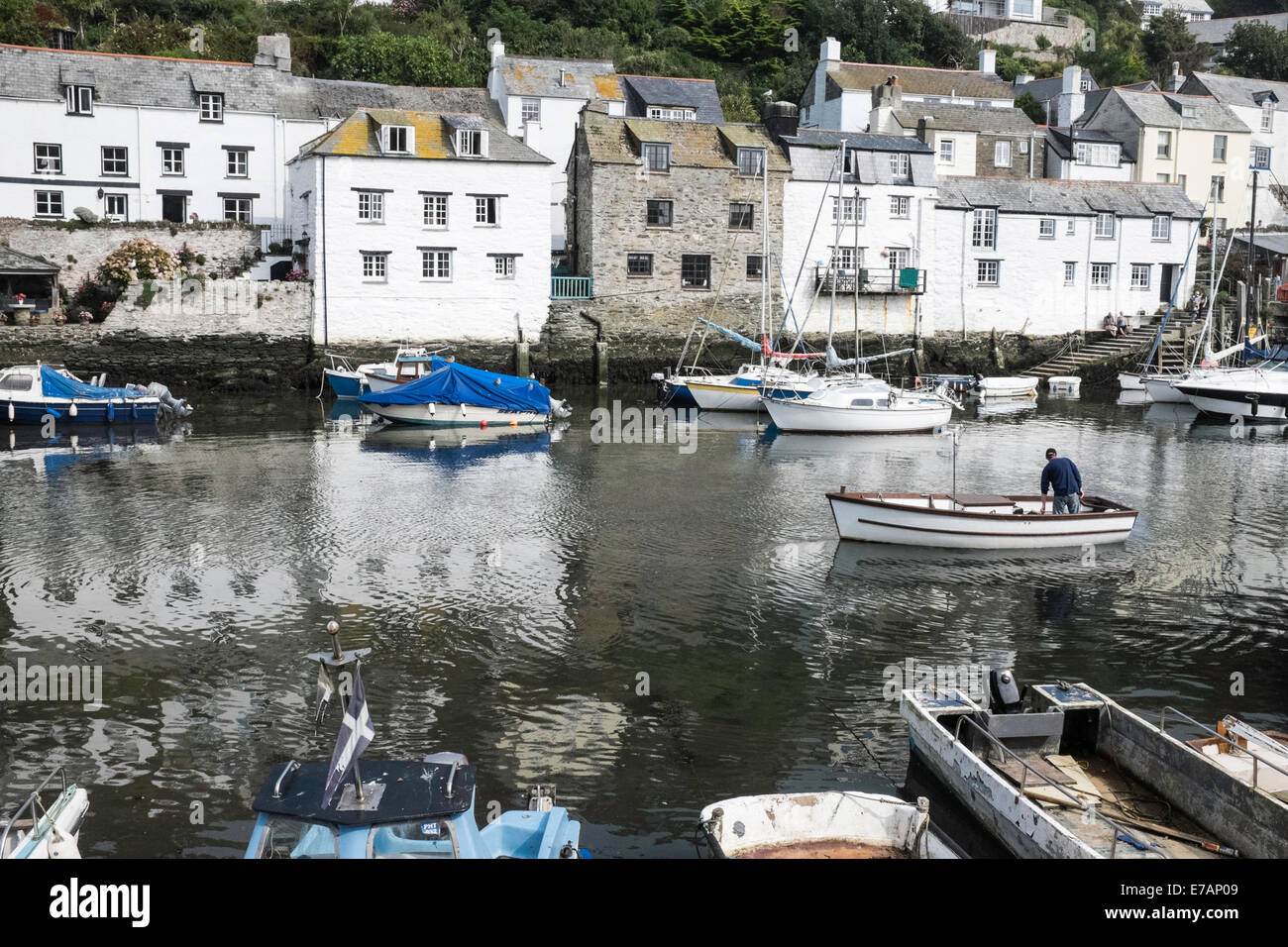 Fishermen's houses and fishing boats in the historic fishing village of Polperro, Cornwall Stock Photo