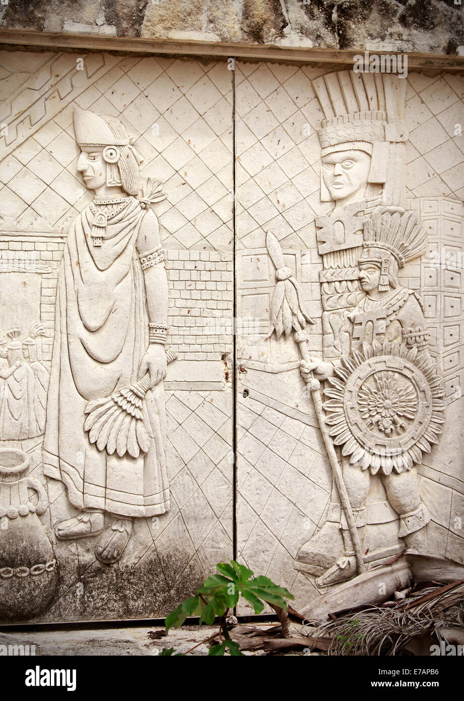 Stone door decorated with ancient mayan sculptures Stock Photo