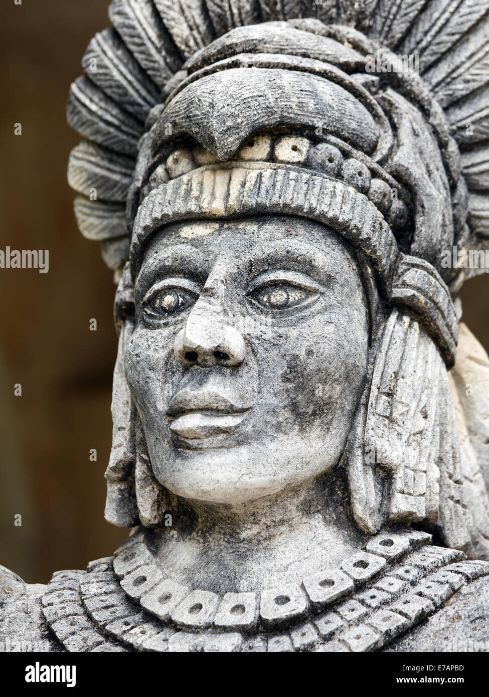 Portrait of stone Mayan warrior on Yucatan Peninsula, Mexico Stock Photo