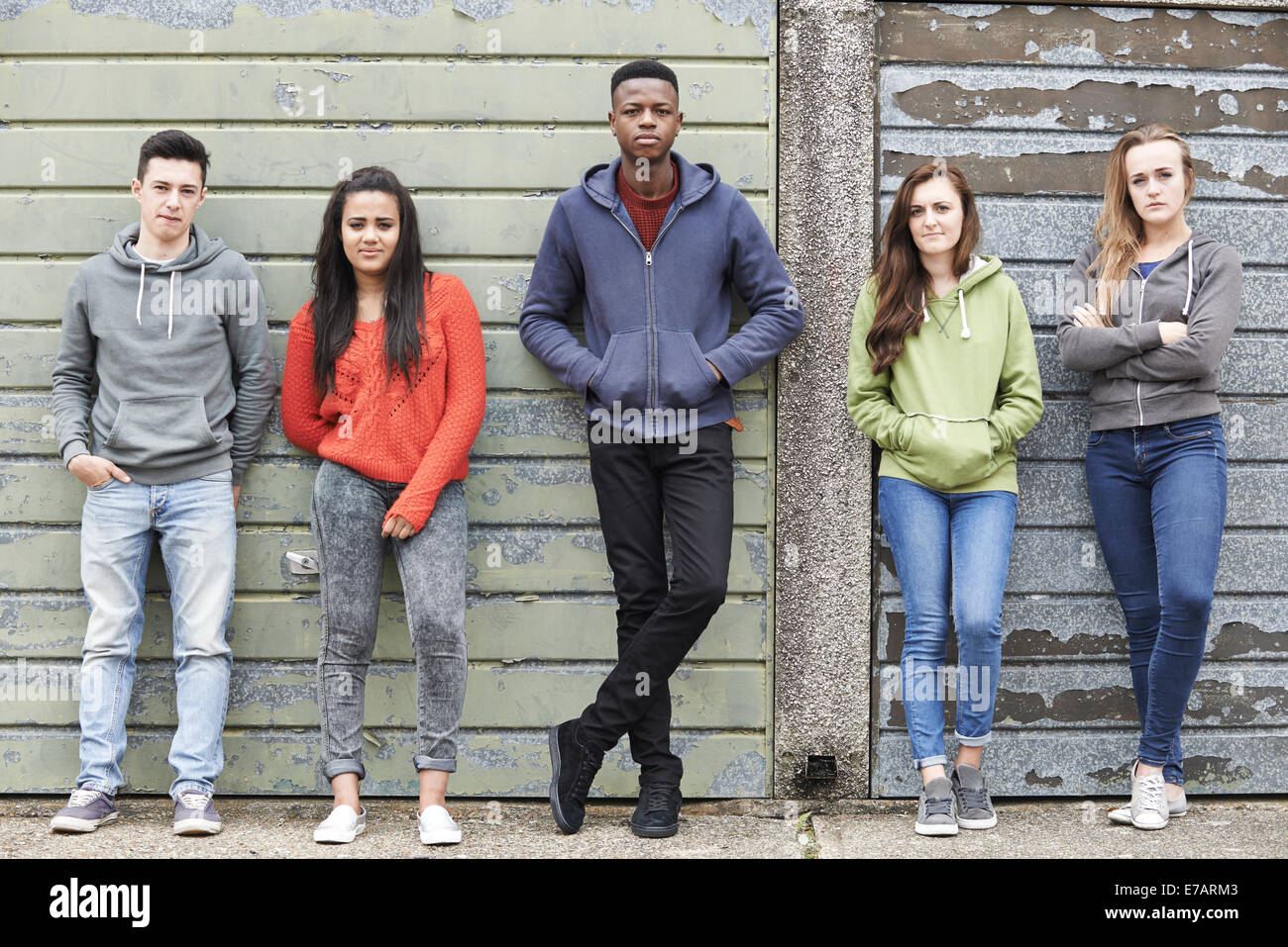 Gang Of Teenagers Hanging Out In Urban Environment Stock Photo