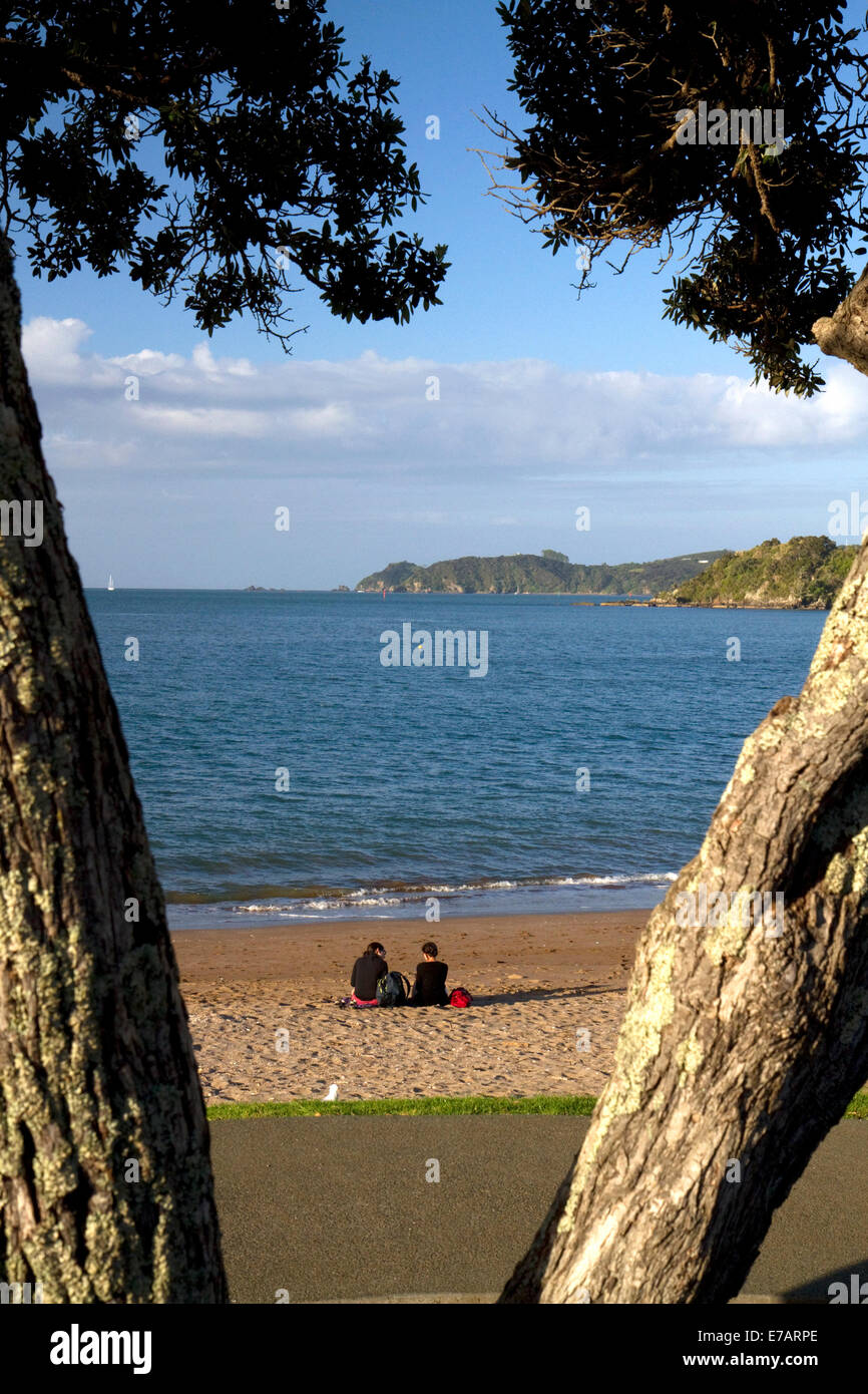 People on the beach at Bay of Islands at the town of Paihia, North Island, New Zealand. Stock Photo