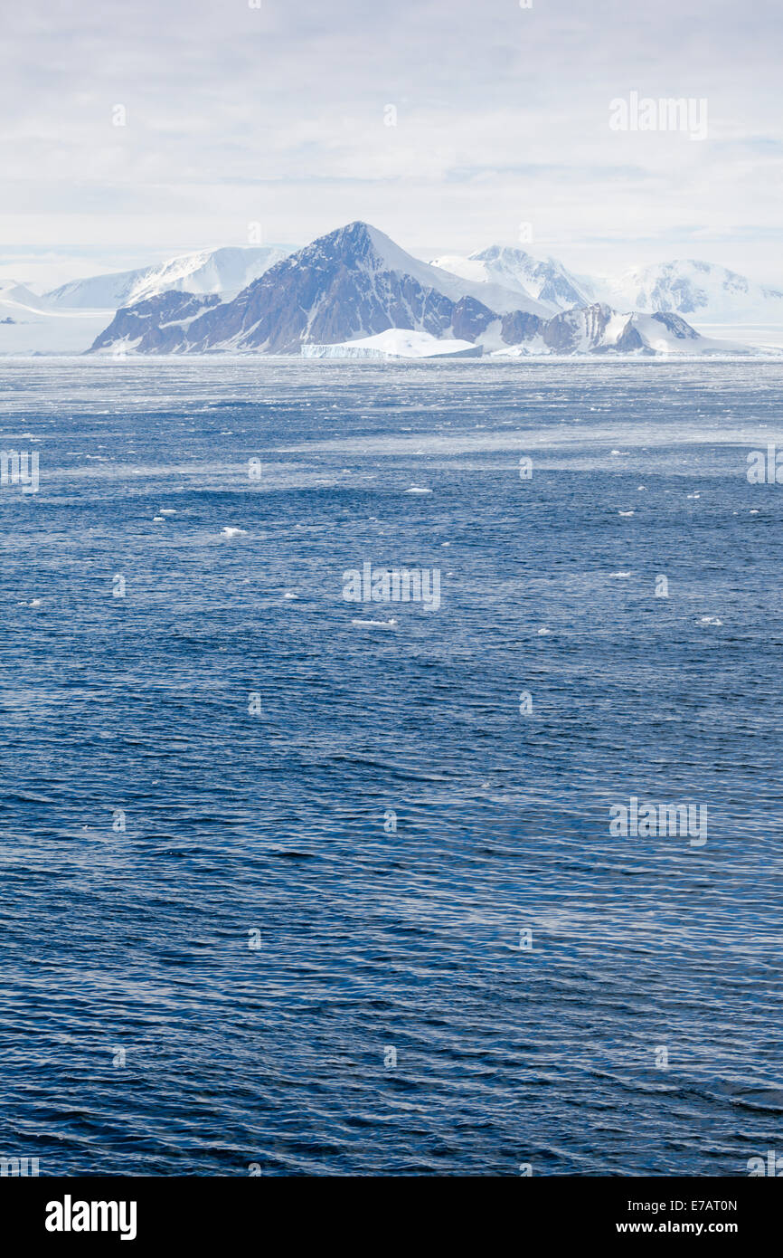 Snowy coastal mountains and ocean, Marguerite Bay, Antarctica Stock Photo