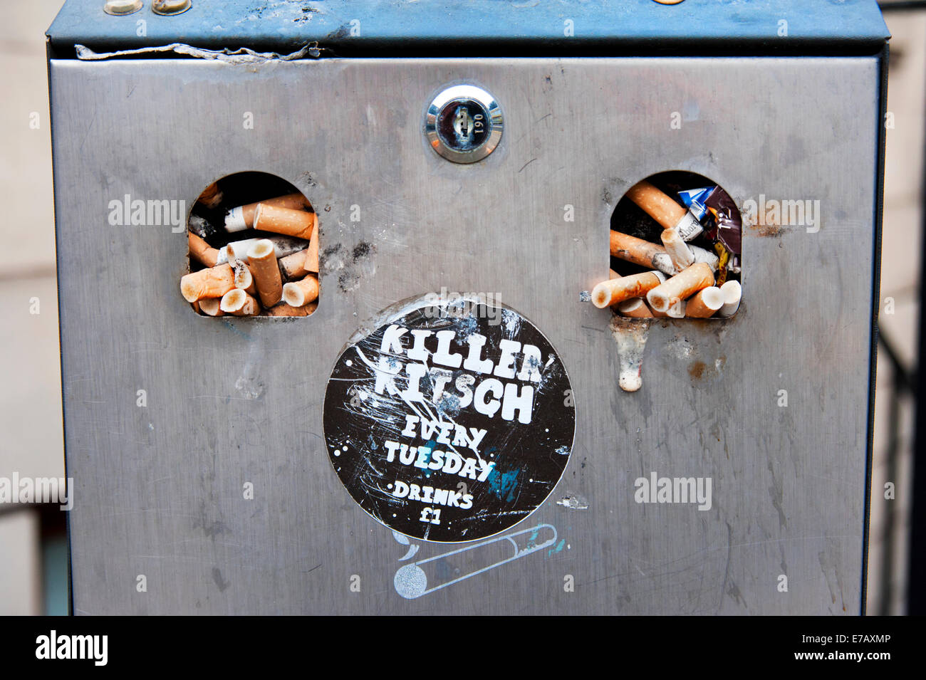 Overflowing bin / street container for cigarette butts, Glasgow City Centre, Scotland Stock Photo