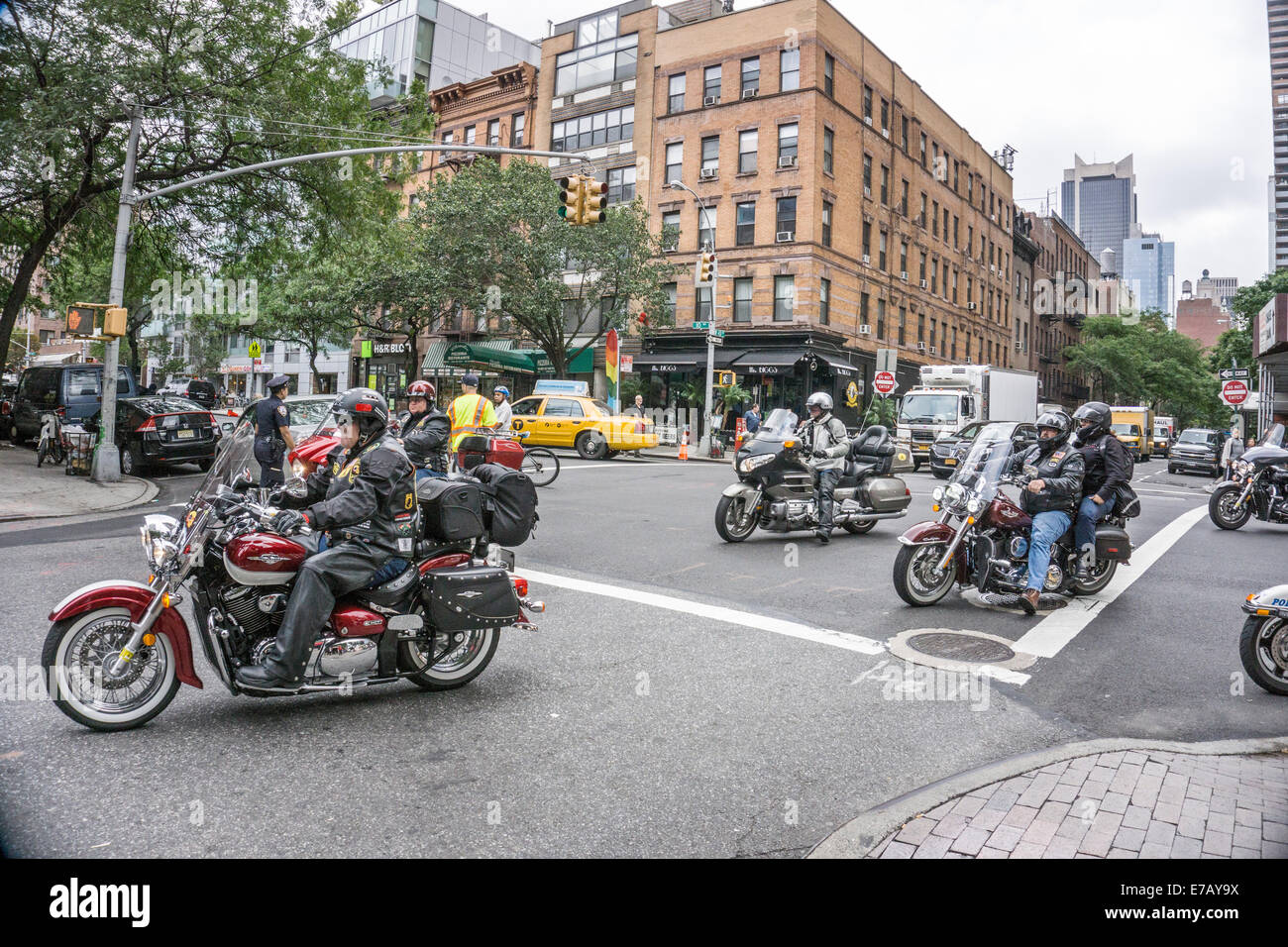 New York City, Thursday, September 11, 2014, USA : in honor of the 13th anniversary of September 11th, more than 250 motorcycle riders participate in a 9/11 Memorial Ride originating in Albany, the state Capital. Among the riders are representatives of local fire and police departments from communities across New York State, including New York City; also State Police & Veterans Associations. On arrival, the riders parking parked their motorcycle motorcycles to be greeted with lunch in front of Rescue 1 Firehouse on 43rd Street. Credit:  Dorothy Alexander/Alamy Live News Stock Photo