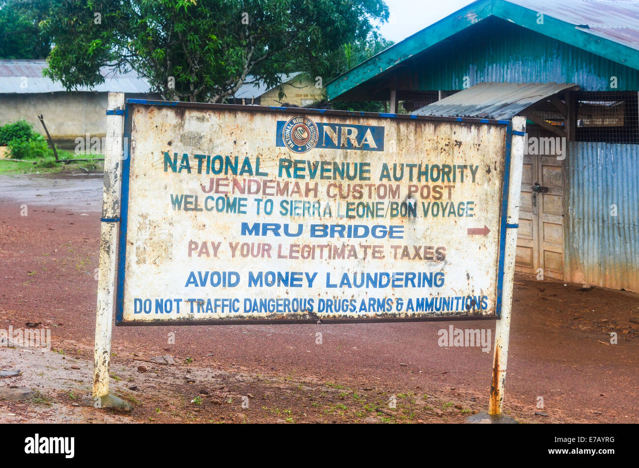 Jendemah border post between Sierra Leone and Liberia, Africa, with a sign board of the customs Stock Photo