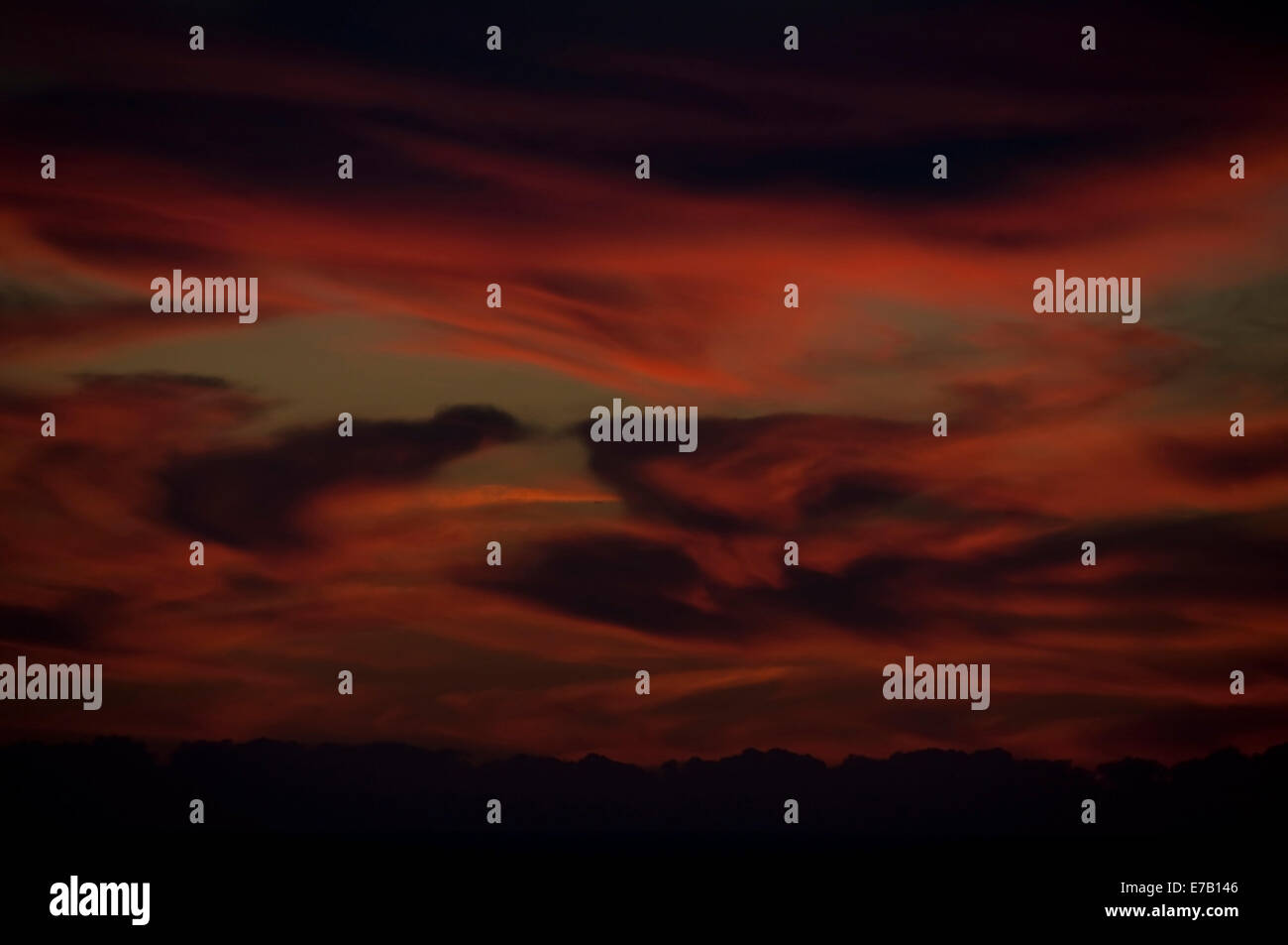 Sunset clouds over horizon. Stock Photo