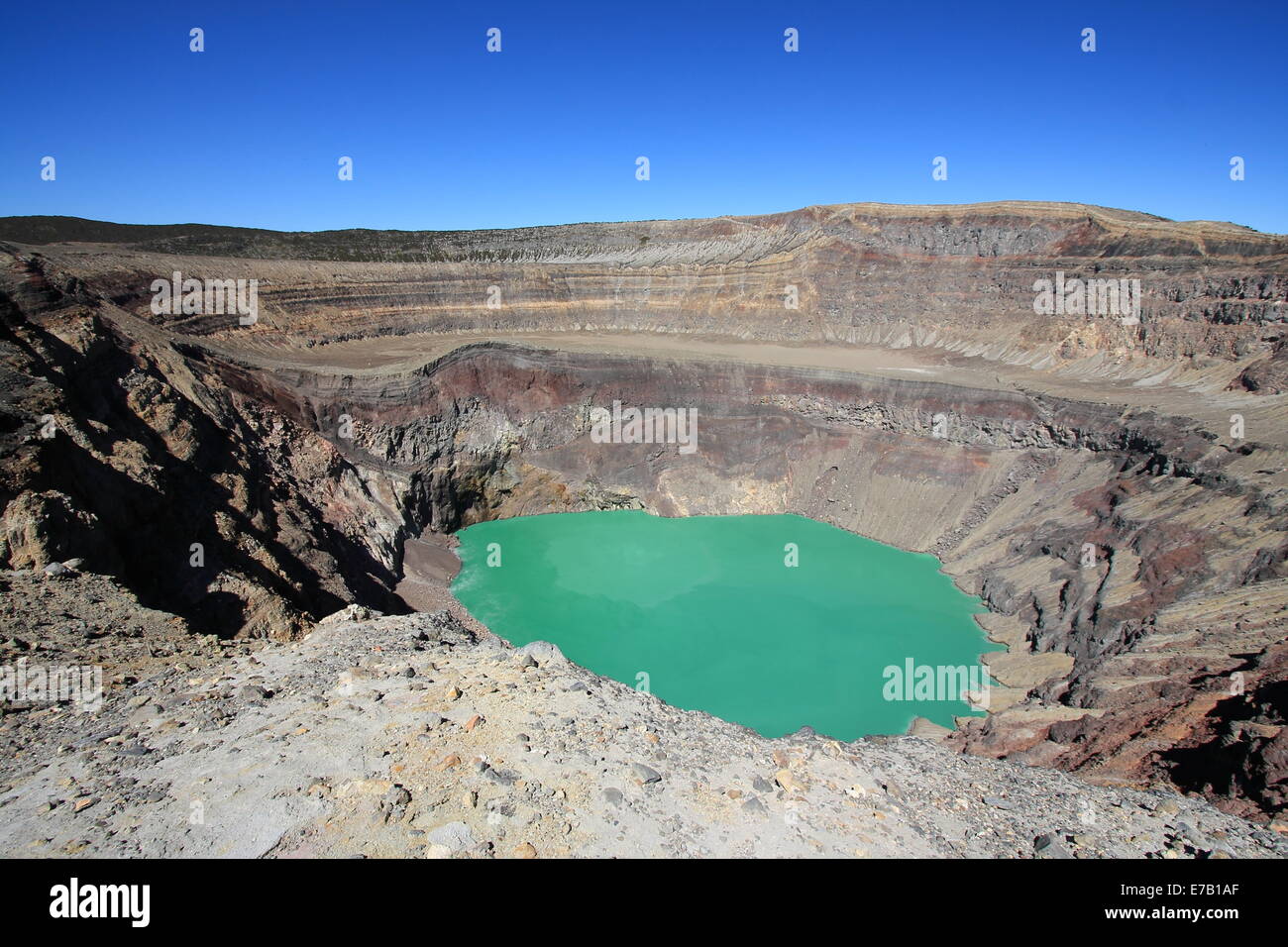 The blue-green lake in the crater of Santa Ana (Ilamatepec) volcano, El Salvador, bubbles slowly due to the geothermal heat. Stock Photo
