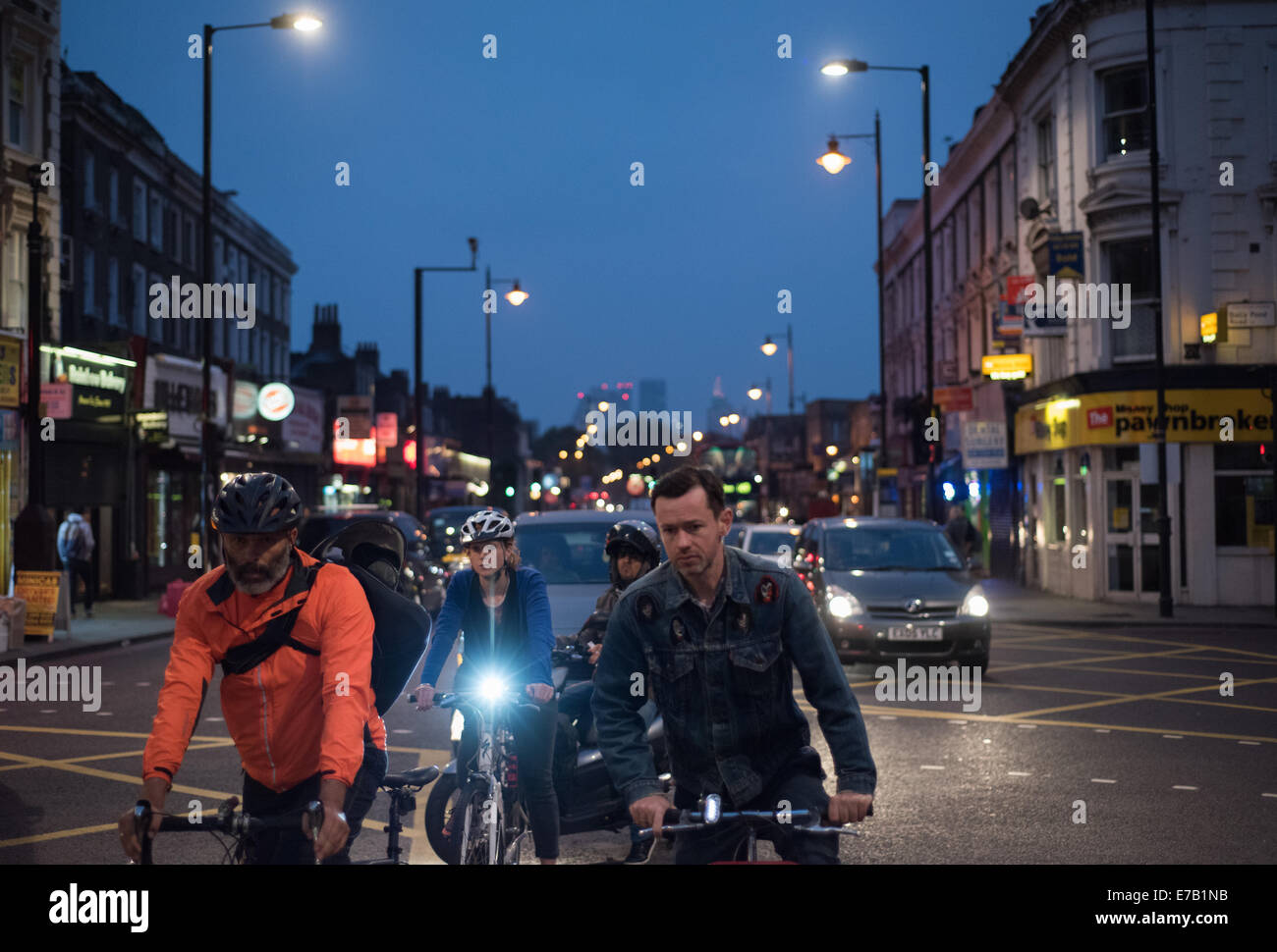 London UK 11 September 2014 Bike Commuters Wait For The Green Light At Dalston Junction 