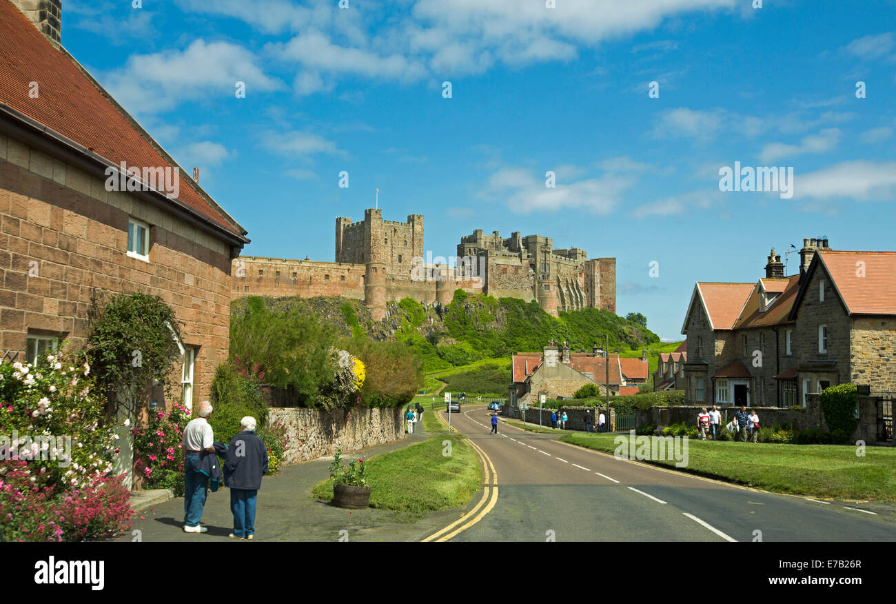 View Of Huge And Historic Bamburgh Castle On Grassy Hill With
