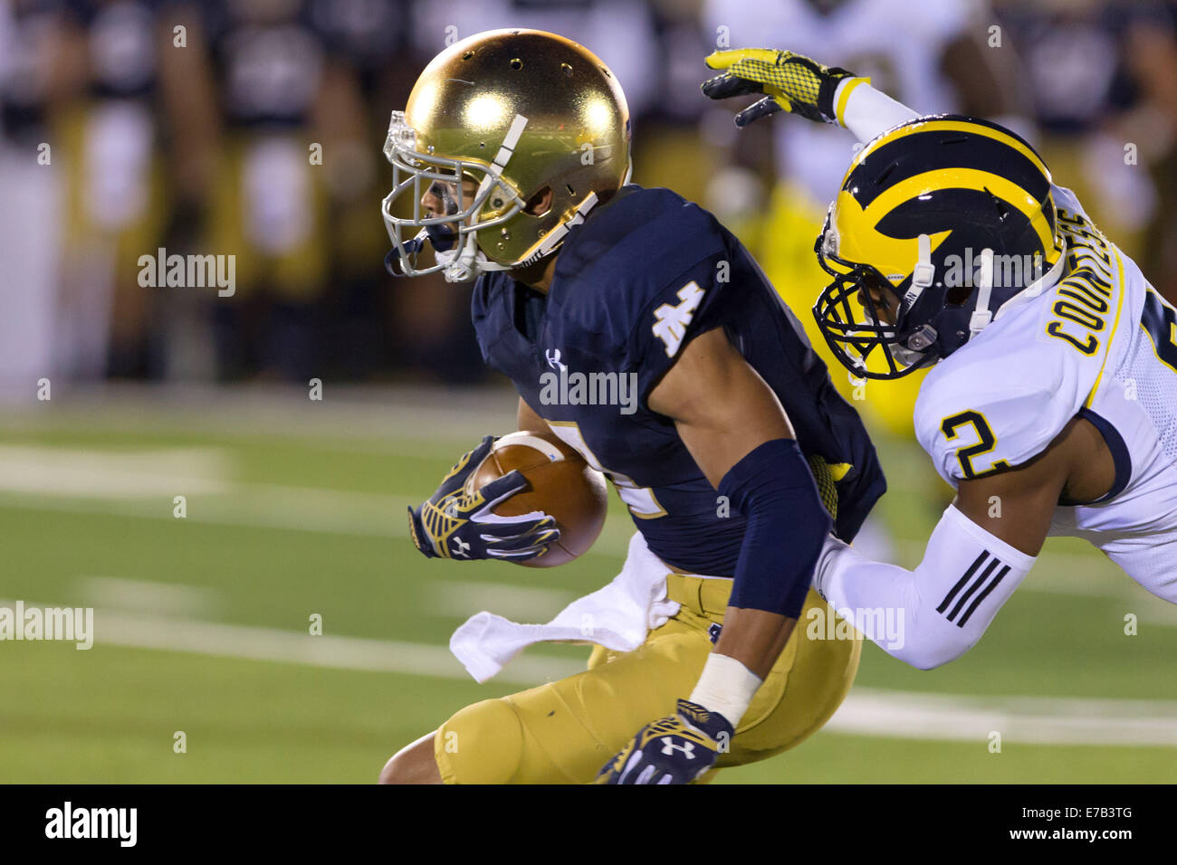 South Bend, Indiana, USA. 6th Sep, 2014. Notre Dame WR WILLIAM FULLER (7) is tackled from behind by Michigan DB BLAKE COUNTESS (2) after making a catch during the second quarter. The Notre Dame Fighting Irish defeated the Michigan Wolverines 31-0 at Notre Dame Stadium in South Bend, Indiana. © Frank Jansky/ZUMA Wire/Alamy Live News Stock Photo