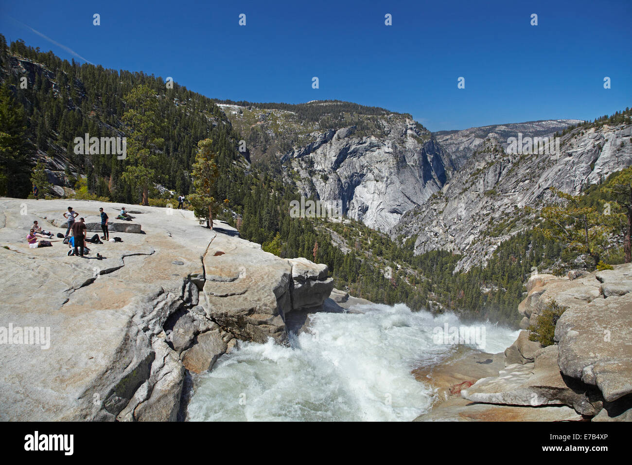 Hikers at the top of Nevada Fall, The Mist Trail, Yosemite National Park, California, USA Stock Photo