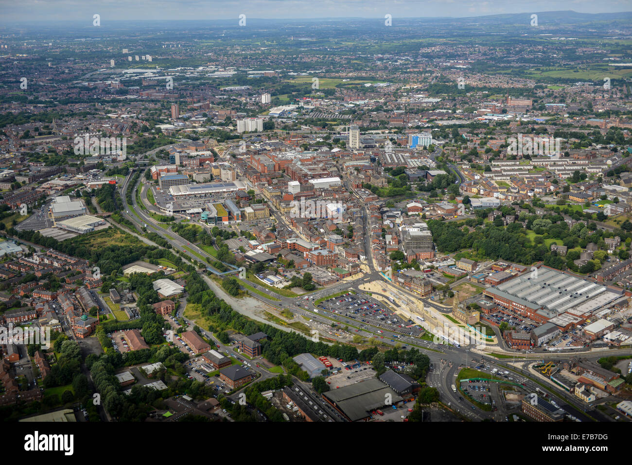 An aerial view across the centre of Oldham, Greater Manchester. Open countryside is visible in the distance. Stock Photo