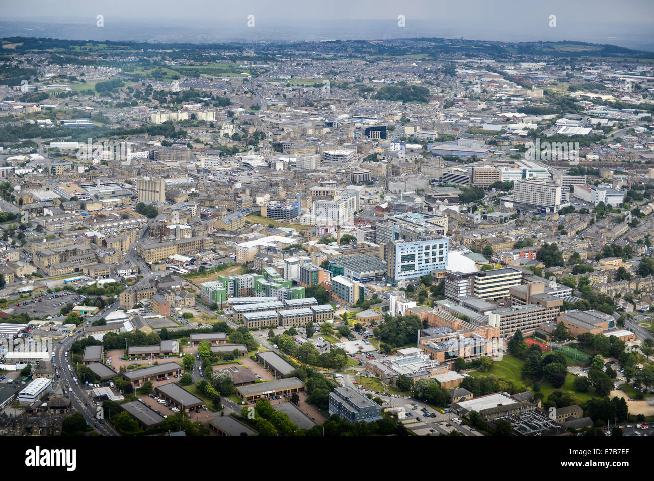 An aerial view of Bradford, West Yorkshire with a rain shower visible in the distance. Stock Photo