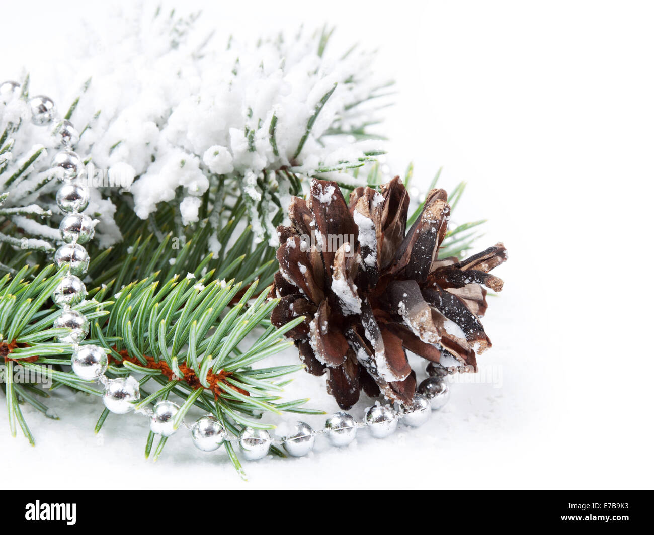 Christmas background with bead, pine cone and fir branch Stock Photo ...