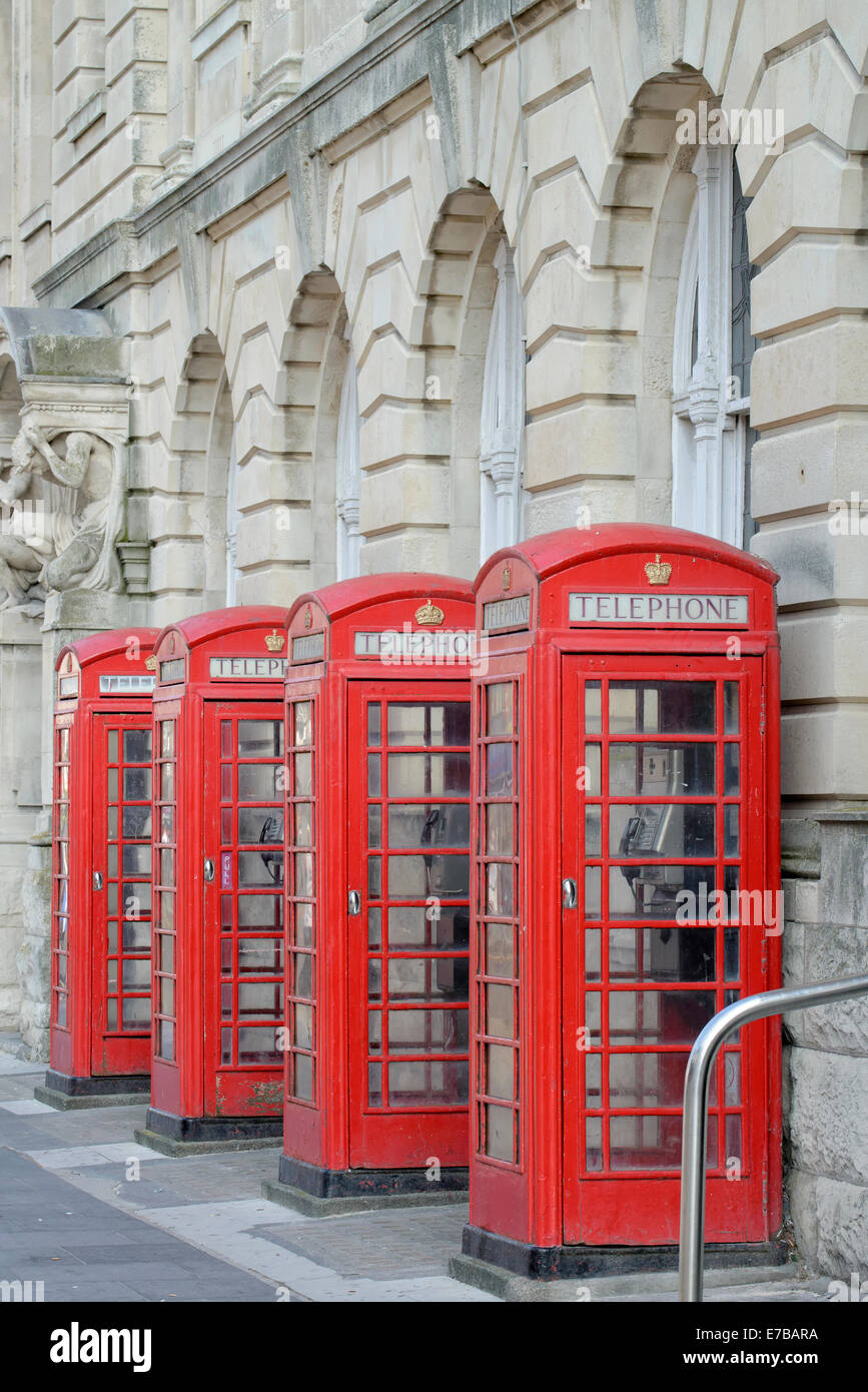 A row of 4 old style BT telephone boxes (in Blackpool, Lancashire) Stock Photo