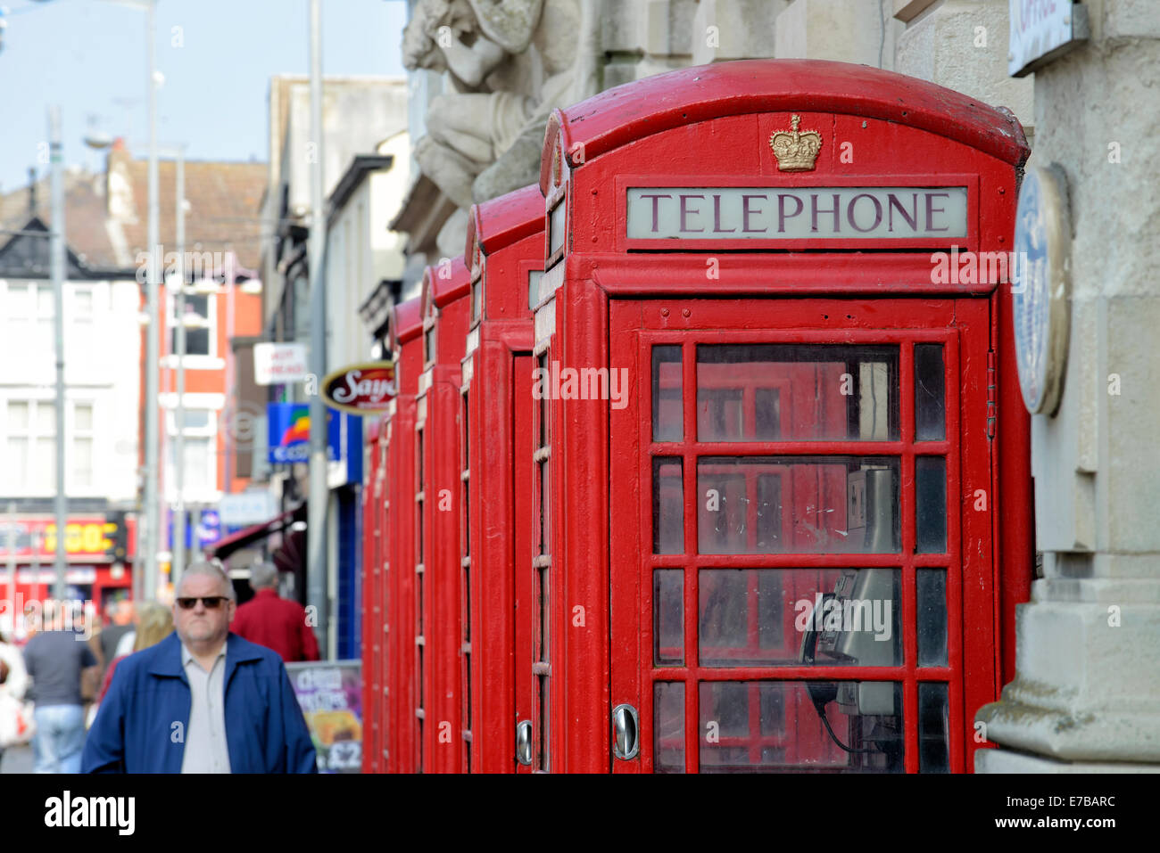 A row of old style BT telephone boxes Stock Photo