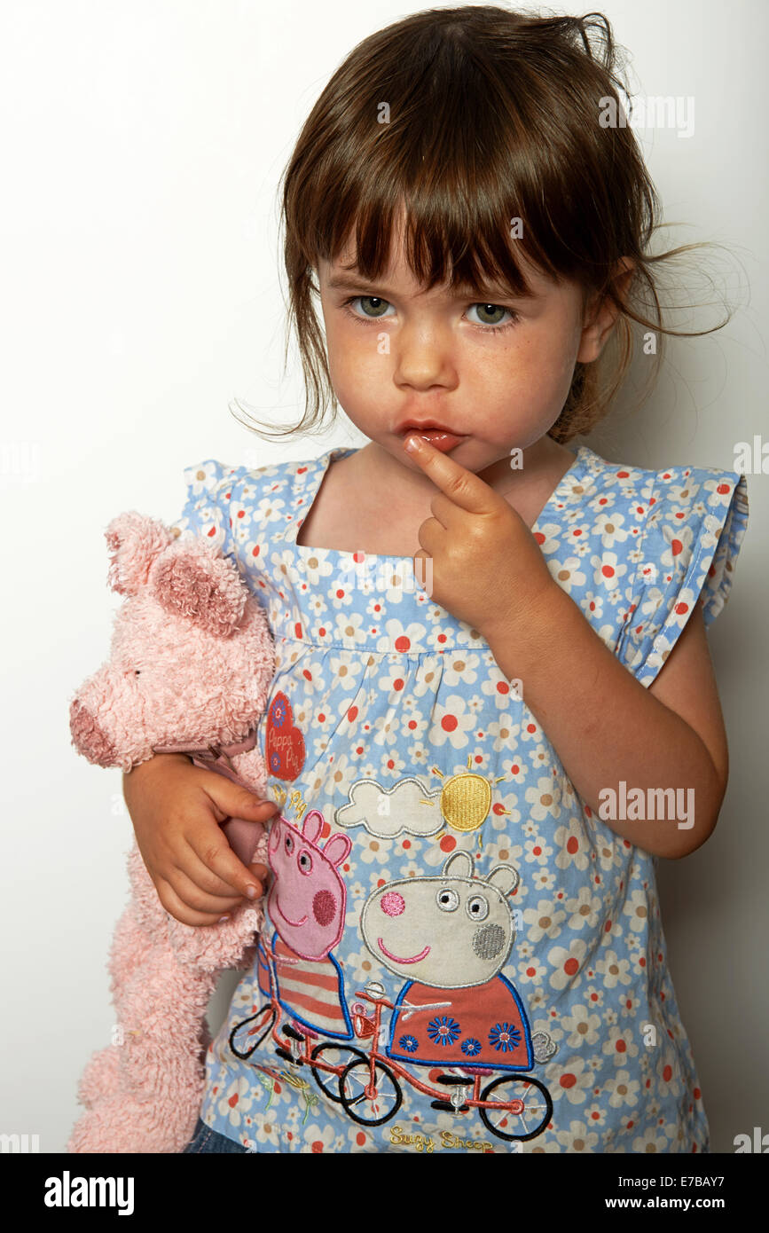 2-year old girl holding teddybear Stock Photo