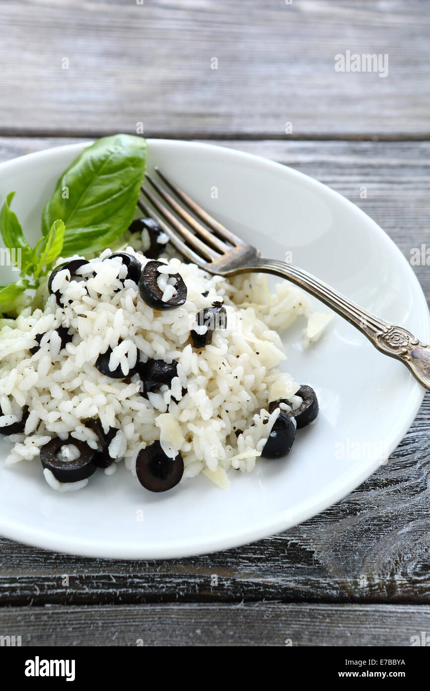 rice with black olives, food closeup Stock Photo Alamy
