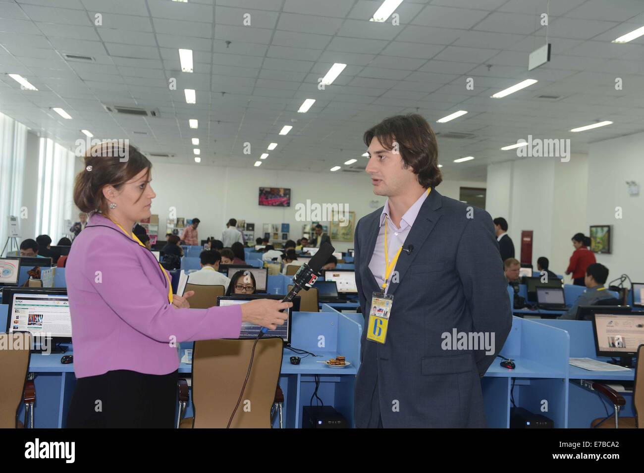 Dushanbe, Tajikistan. 12th Sep, 2014. A Tajik journalist (L) interviews