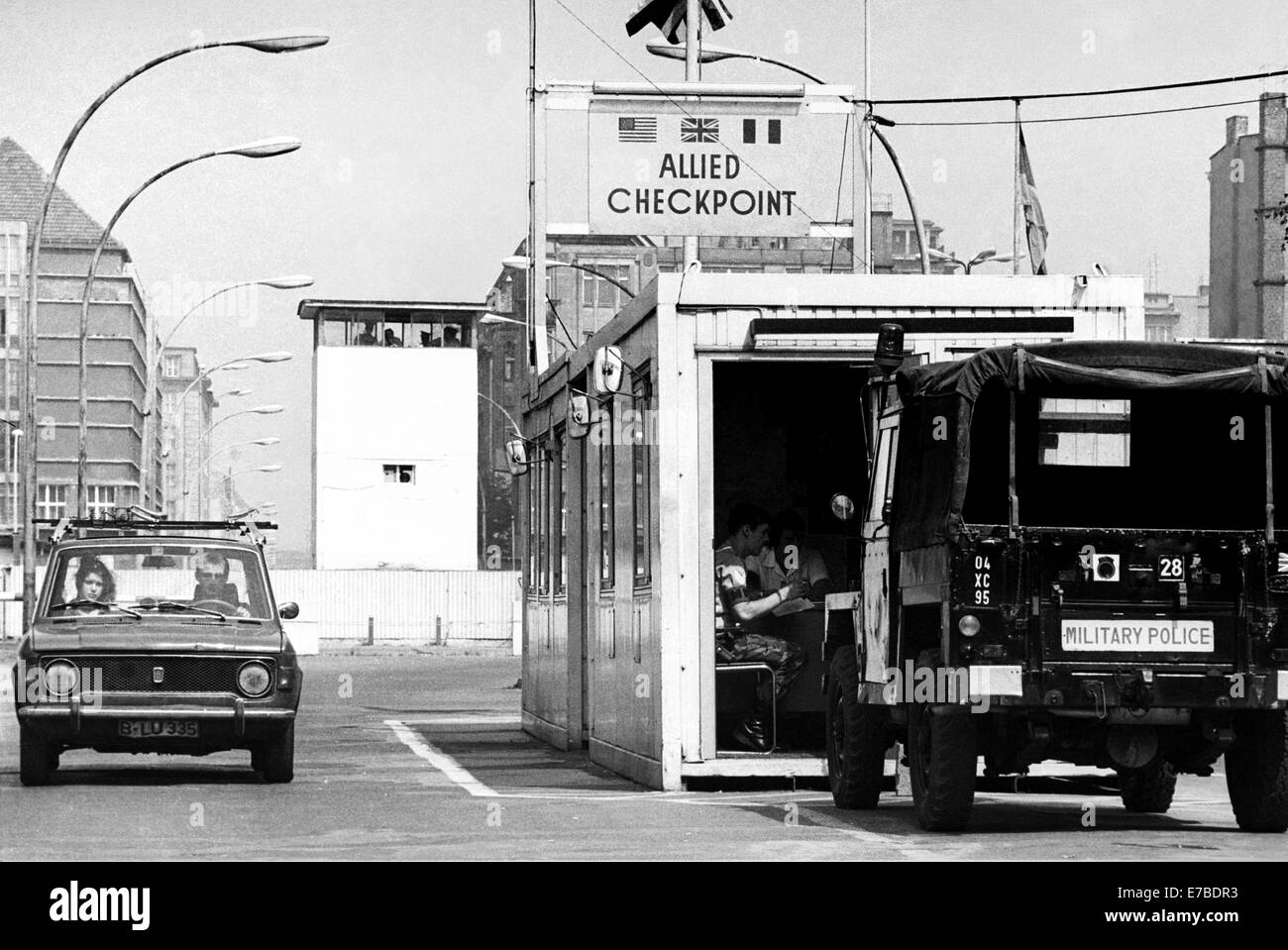 the Berlin Wall at the border crossing Checkpoint Charlie, in the