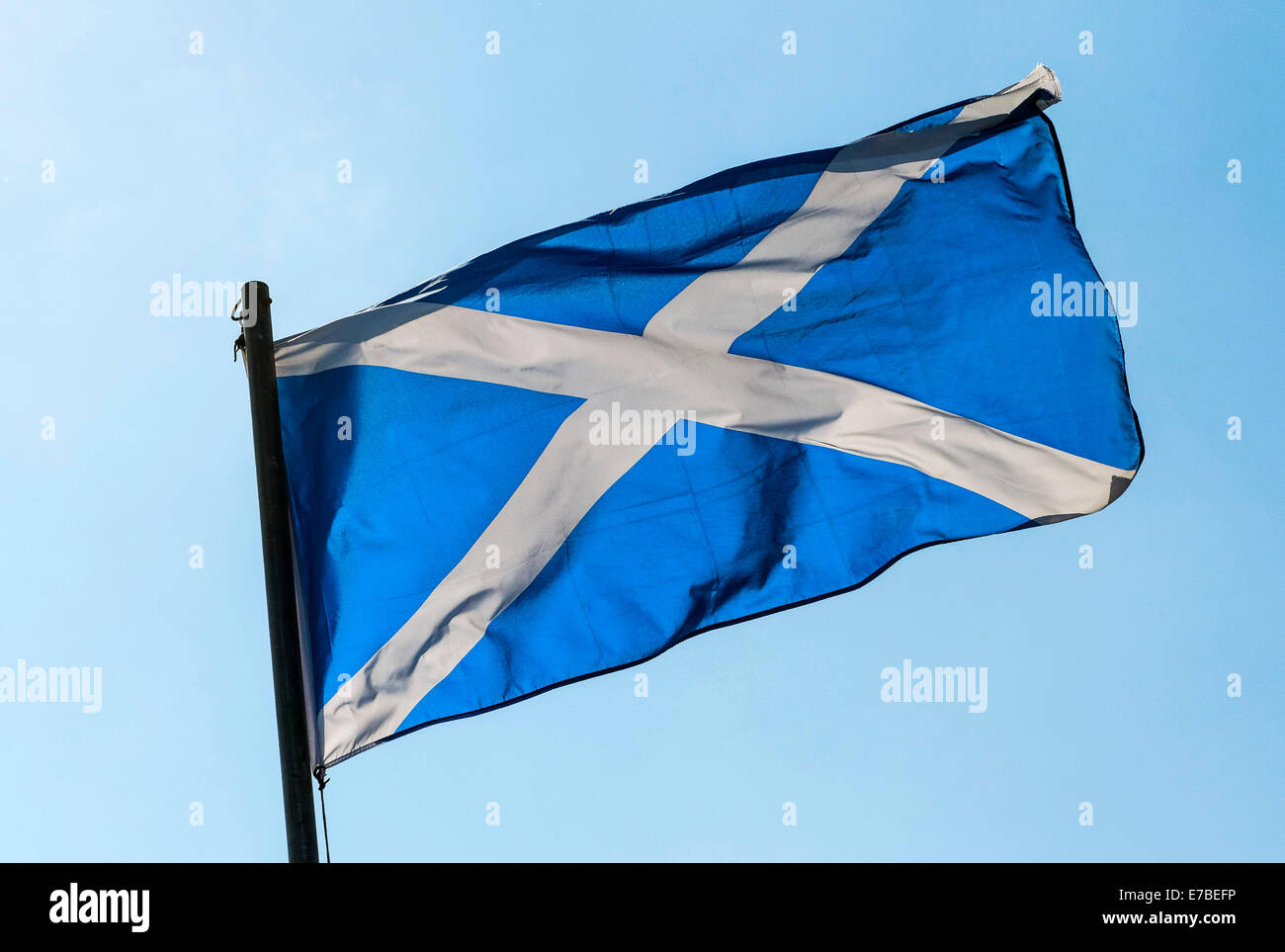The Saltire, Scottish flag, flying against a blue sky, Oban, Scotland, United Kingdom Stock Photo