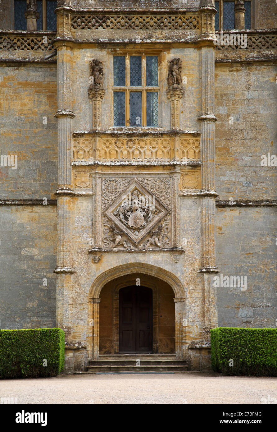 Entrance porch and coat of arms at Montacute House an Elizabethan Ham stone manor in Somerset Stock Photo