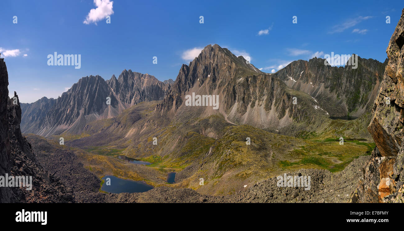 Mountain peaks. View from pass Dinosaur. Eastern Sayan. Tunka ridge. Republic of Buryatia Stock Photo