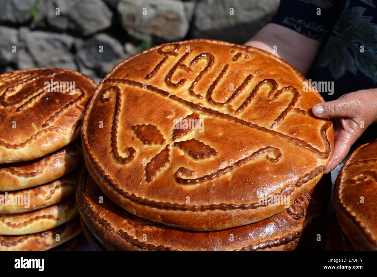 Geghard, Armenia. 29th June, 2014. Loafs of sweet bread decorated with Armenian writing lie at a sales booth at the monastery of Geghard, Armenia, 29 June 2014. Photo: Jens Kalaene -NO WIRE SERVICE-/dpa/Alamy Live News Stock Photo
