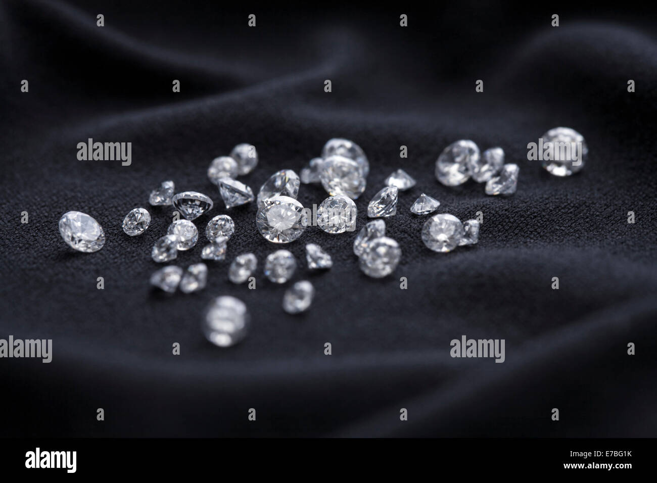Clear gemstones on a black cloth. Stock Photo