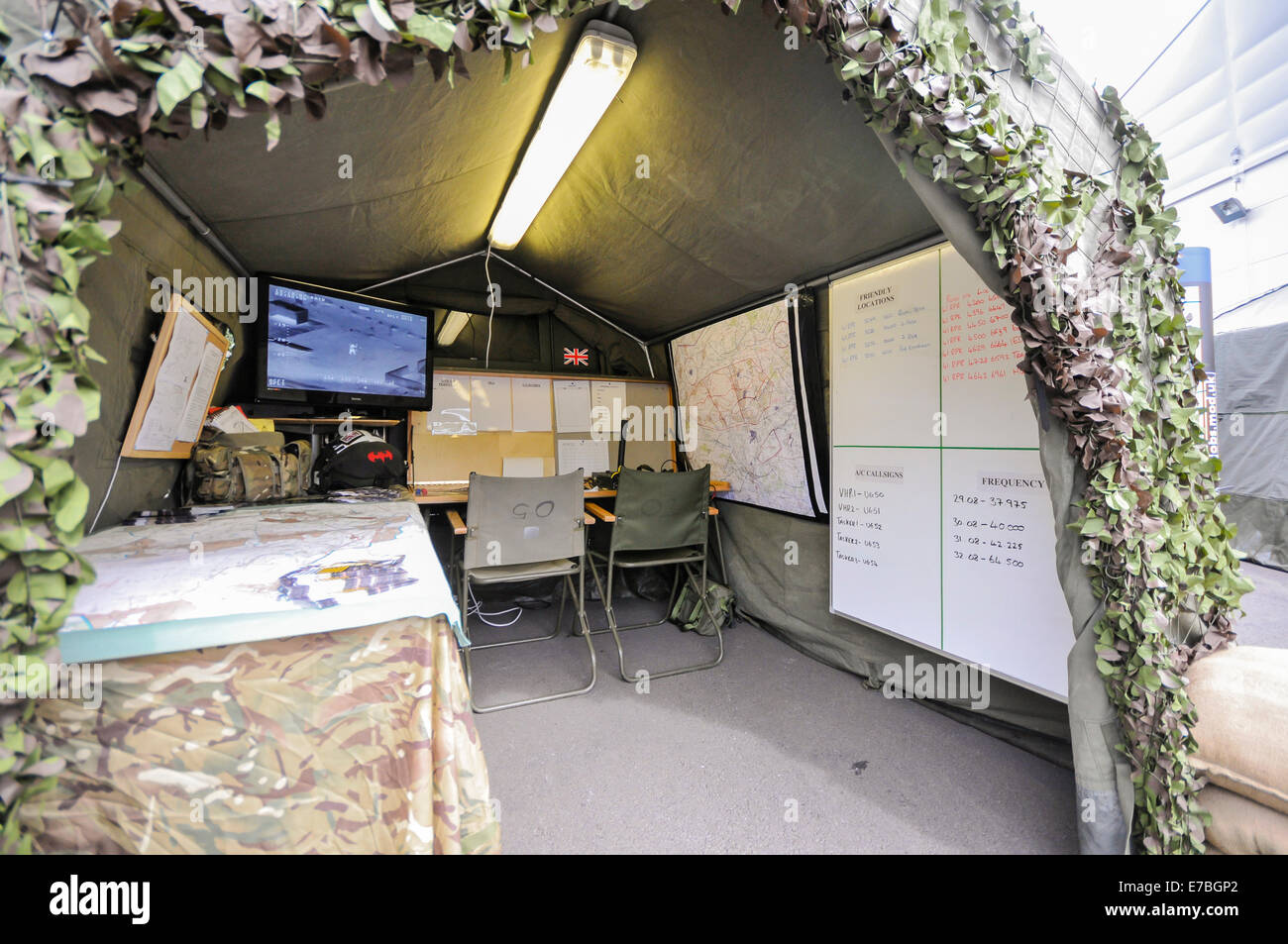 Mobile military command centre, set up on a camouflaged tent. Stock Photo