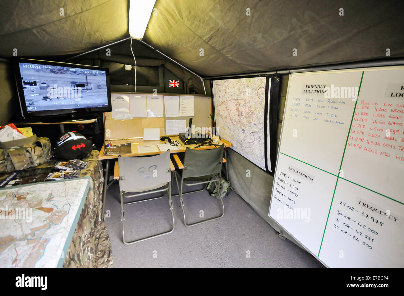 Mobile military command centre, set up on a camouflaged tent. Stock Photo