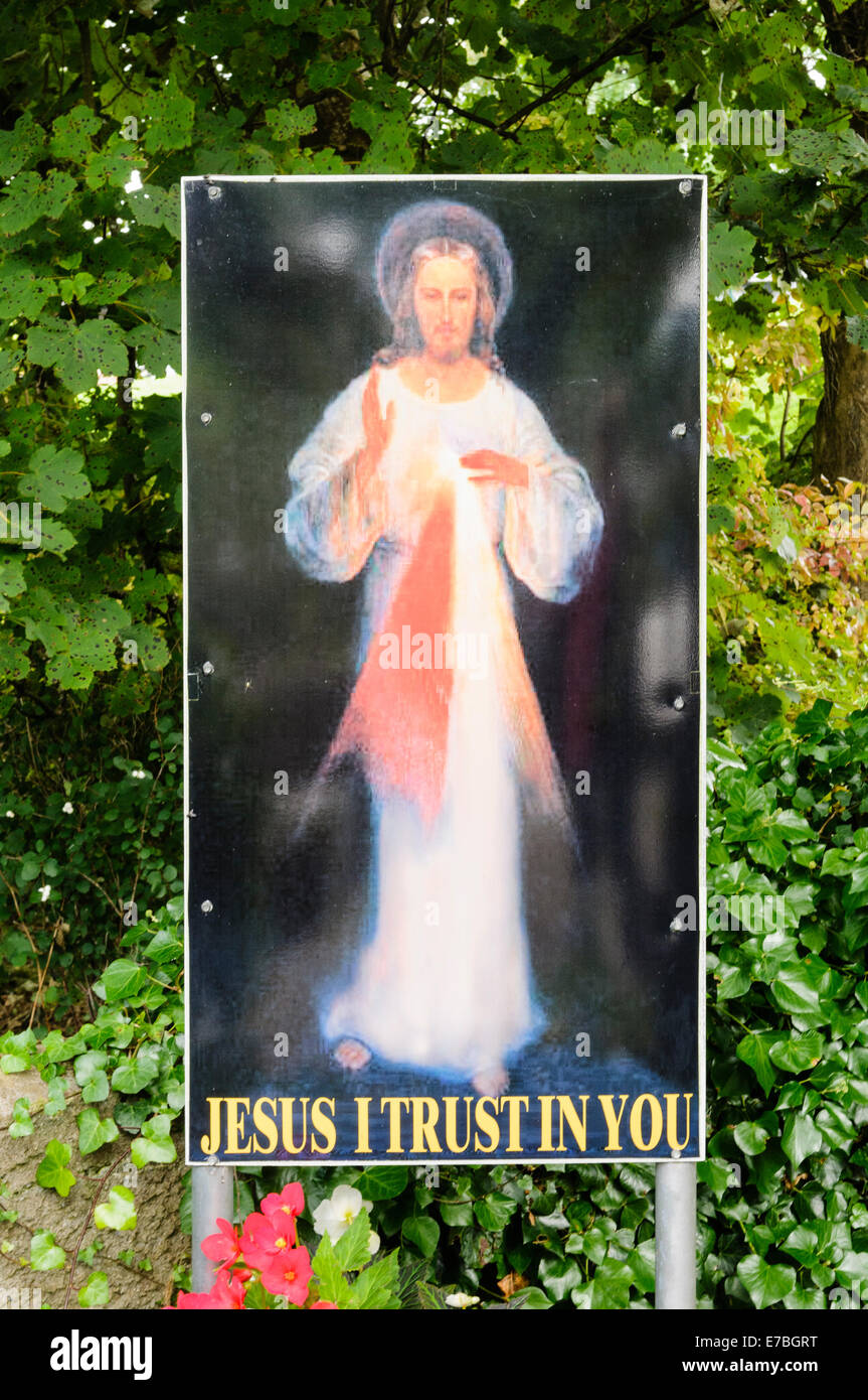Sign at a holy shrine saying 'Jesus I trust in you' Stock Photo