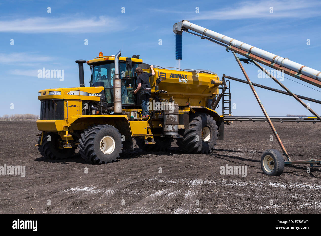 Loading the AirMax 1000 Terra-Gator fertilizer spreader on the Froese farm near Winkler, Manitoba, Canada. Stock Photo