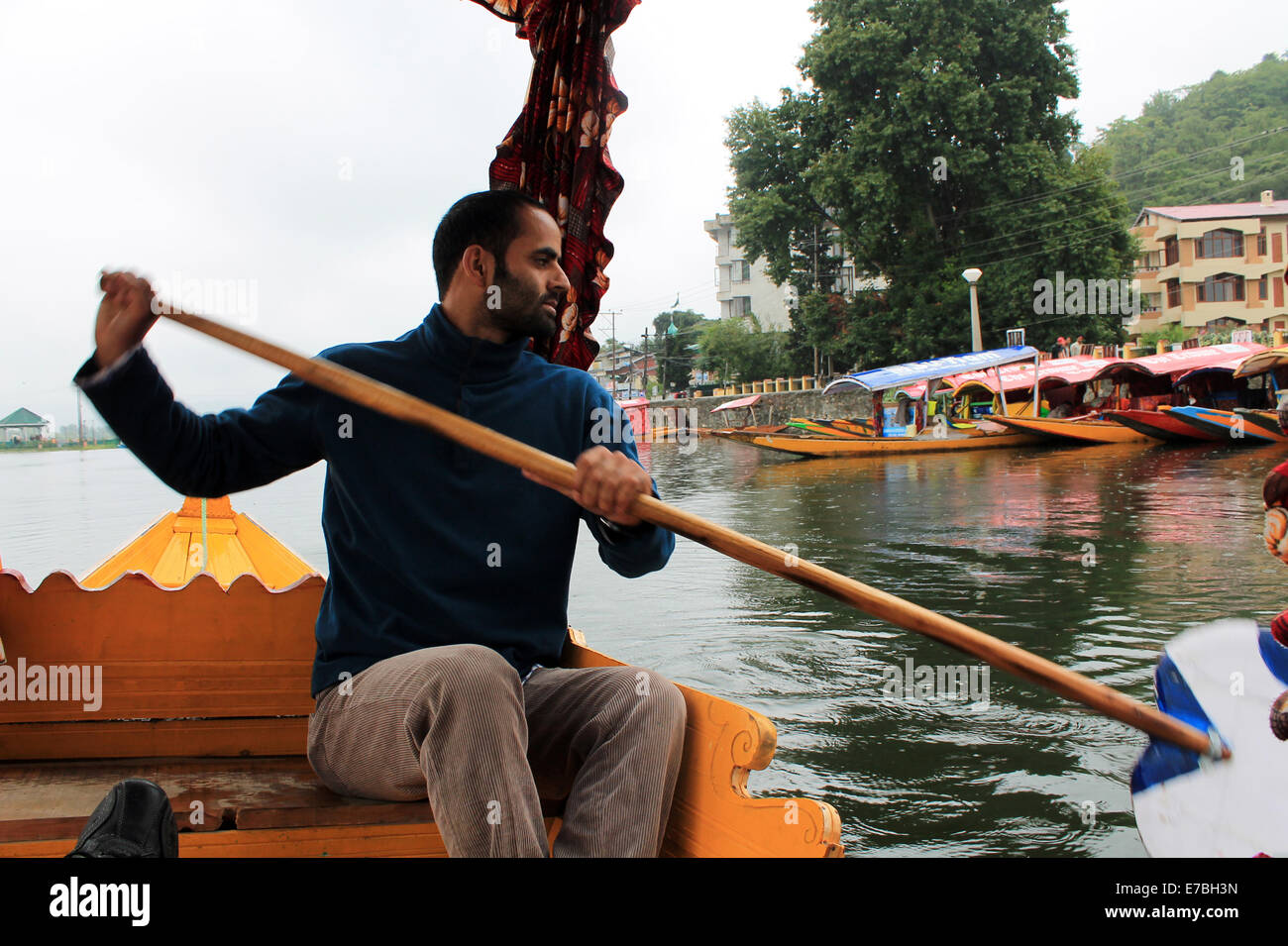 Men paddling a boat in India Stock Photo Alamy