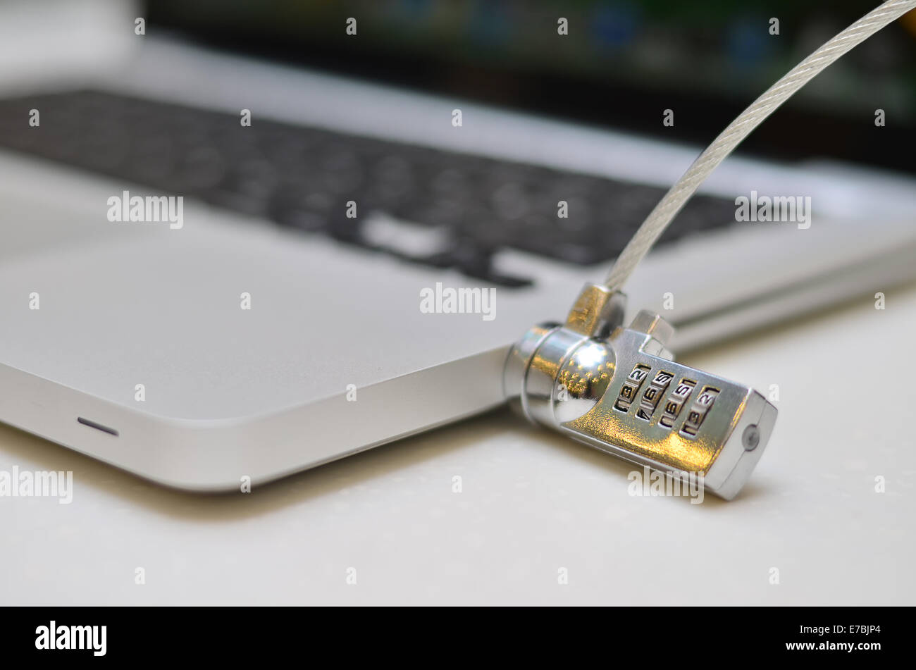 Laptop locked with a key padlock Stock Photo Alamy