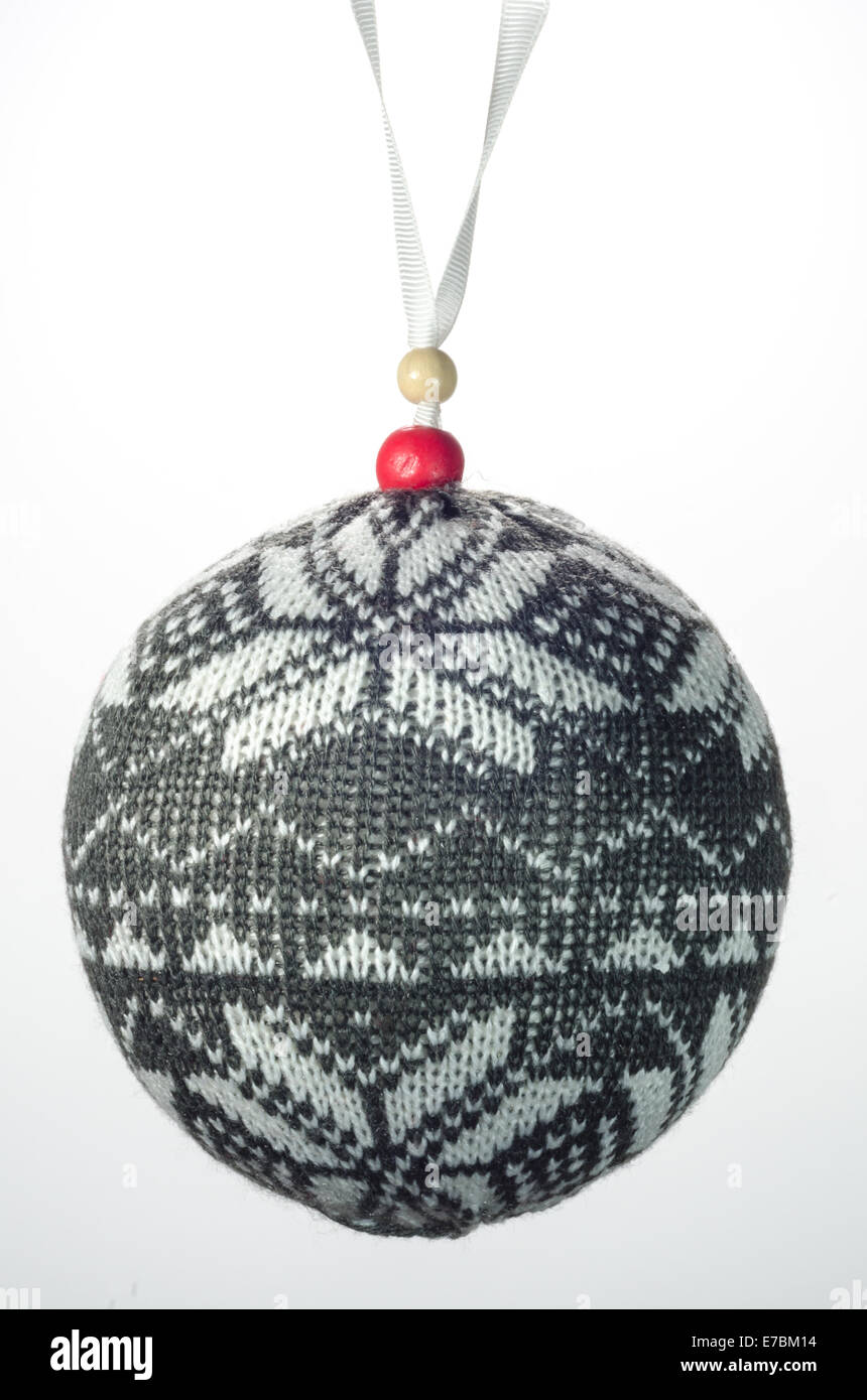 A gray and white knit Christmas ornament isolated on white Stock Photo