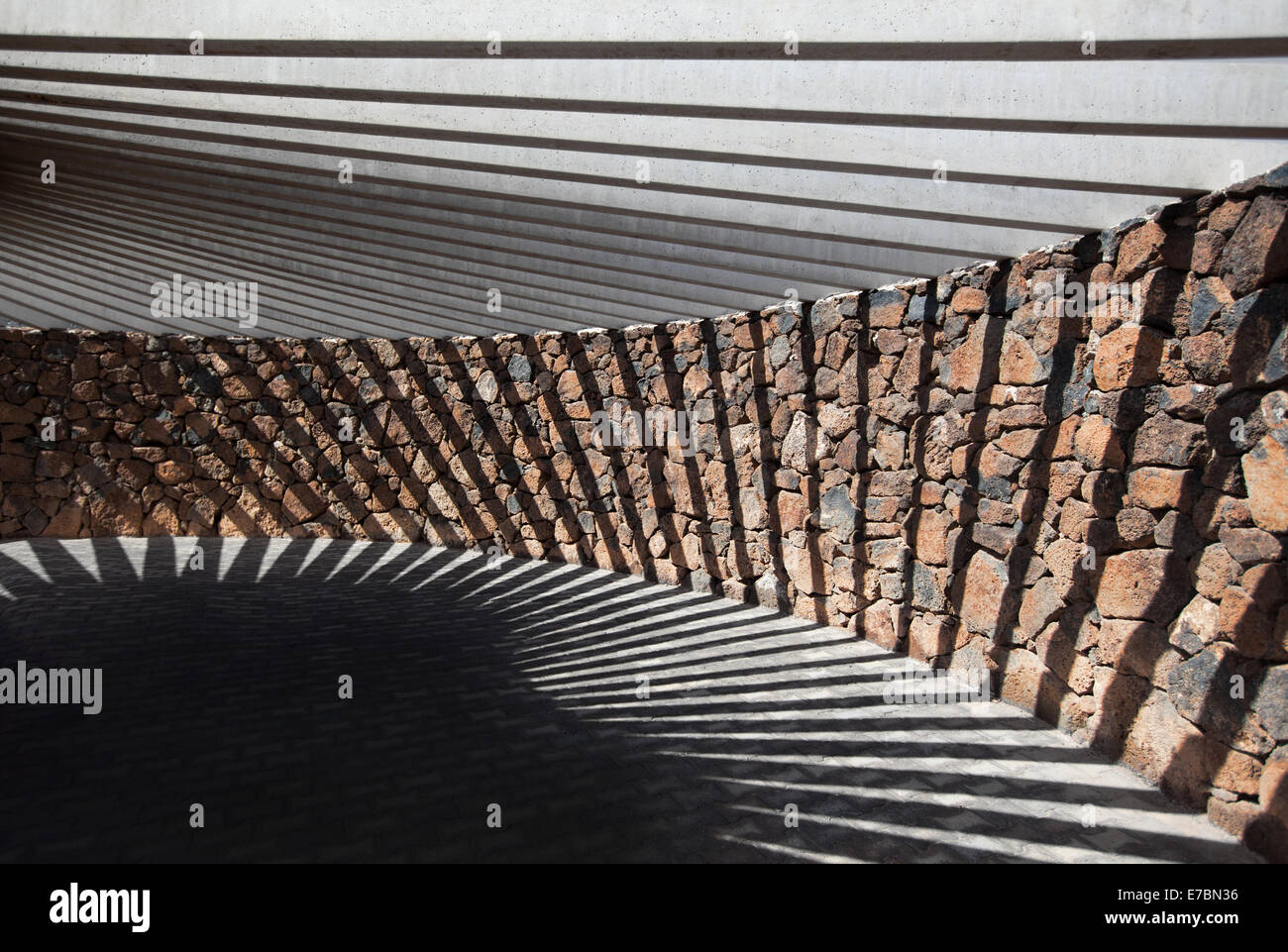 Pavilion of stone and concrete with geometric shadow Stock Photo