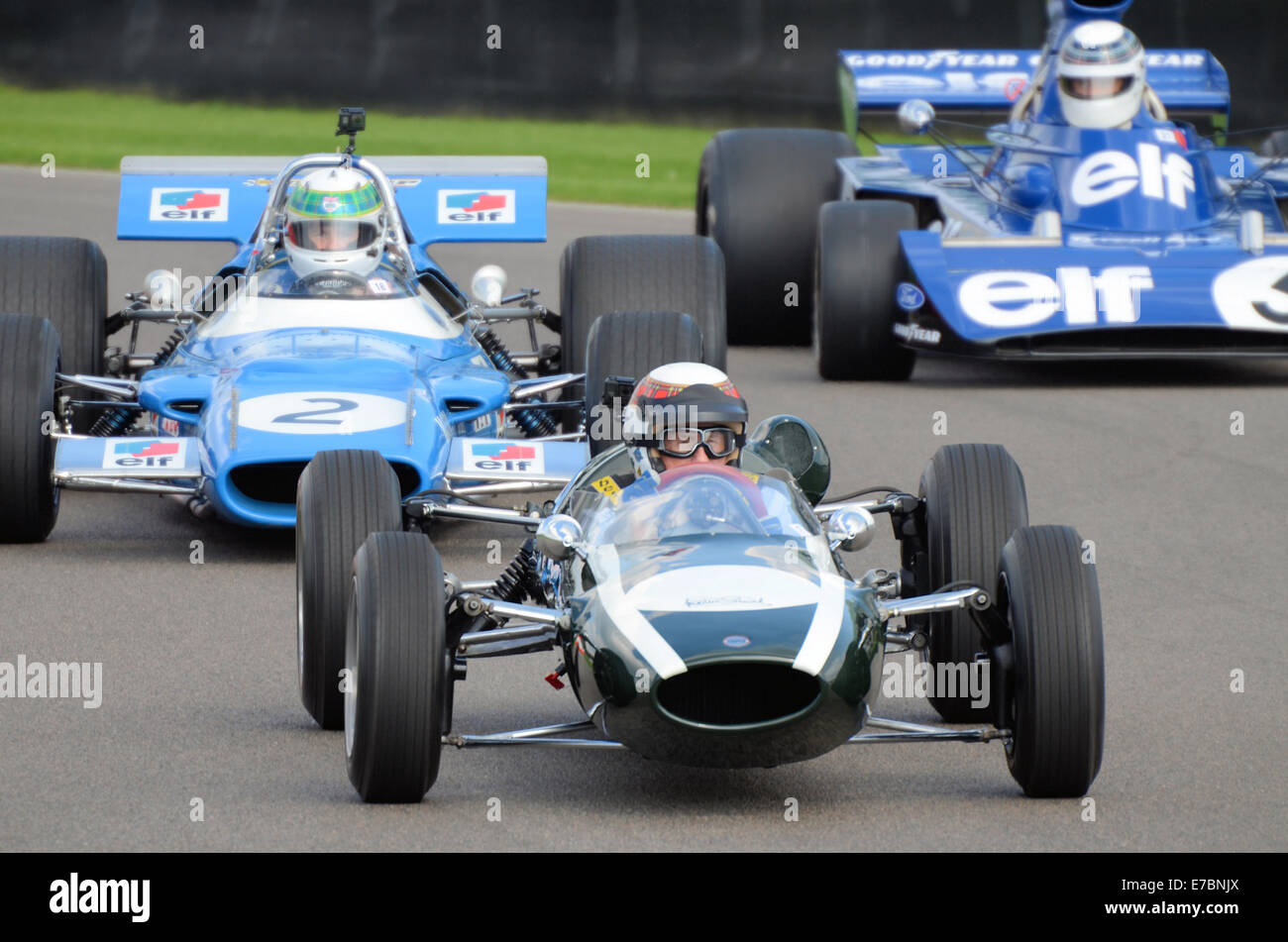 Sir Jackie Stewart led a number of his former racing cars around the track at the Goodwood Revival. Racing driver Stock Photo