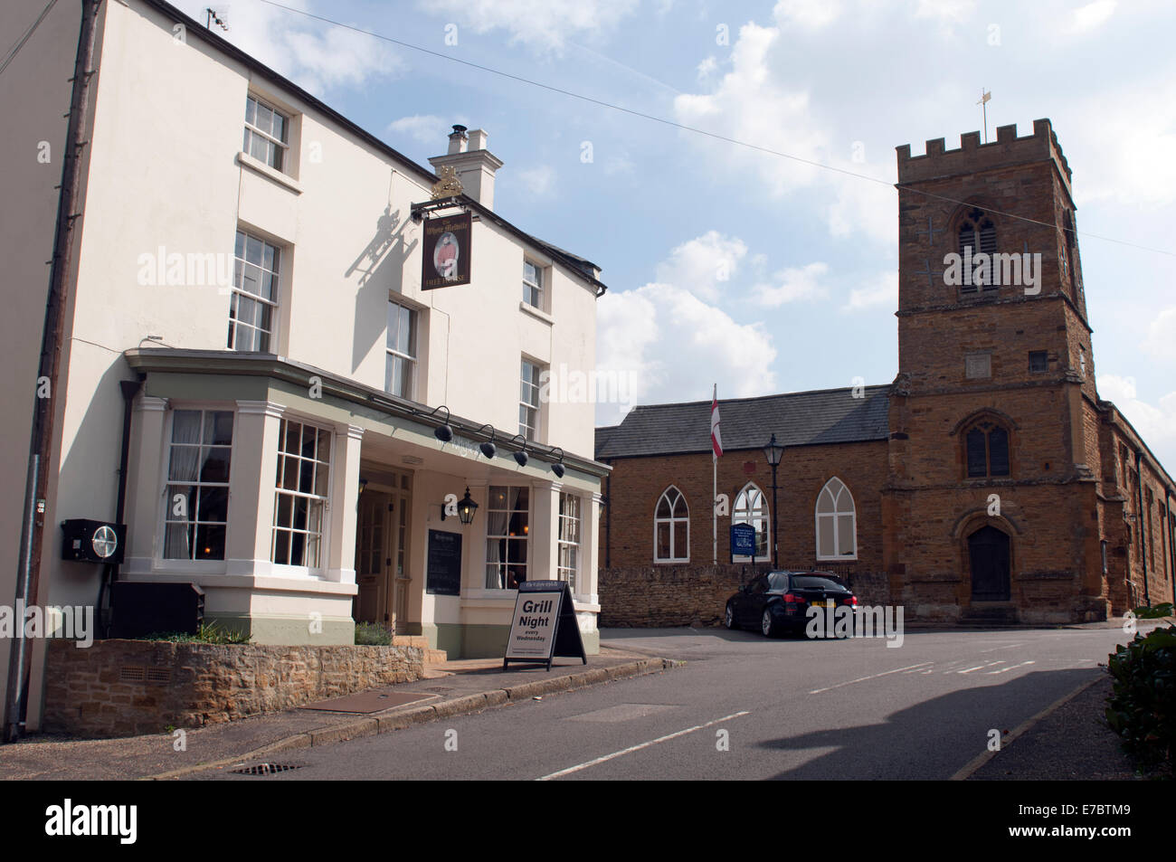 The Whyte Melville pub and St. John the Baptist Church, Boughton, Northamptonshire, England, UK Stock Photo