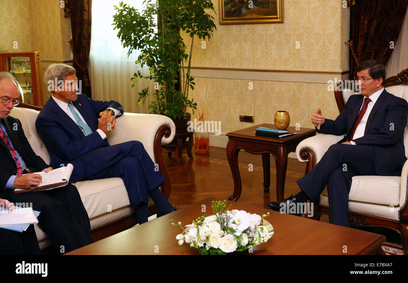 Ankara. 12th Sep, 2104. Turkey's Prime Minister Ahmet Davutogluin (R) meets with U.S. Secretary of State John Kerry (2nd L) in Ankara, Sept. 12, 2104. U.S. Secretary of State John Kerry paid a visit to Ankara on Friday to urge Turkey for more contribution to a U.S.-led coalition aiming at fighting Islamic State (IS) militants in Iraq and Syria. © Mert Macit/Xinhua/Alamy Live News Stock Photo