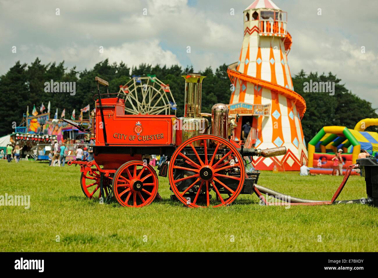 A Victorian horse-drawn fire engine stands at a fair ground Stock Photo