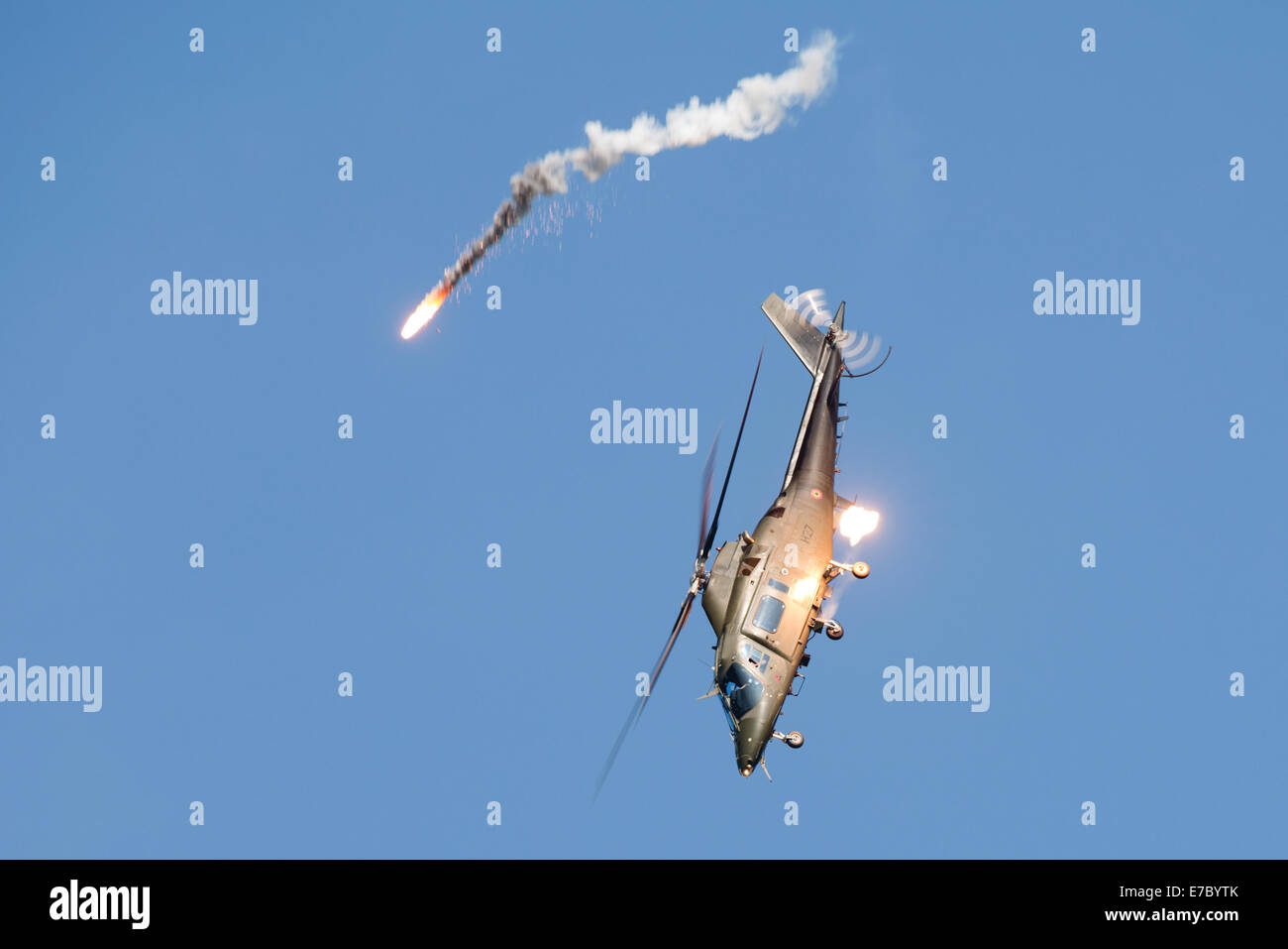 PAYERNE, SWITZERLAND - SEPTEMBER 6: Agusta A-109 releases flares on dynamic display at AIR14 airshow in Payerne, Switzerland Stock Photo