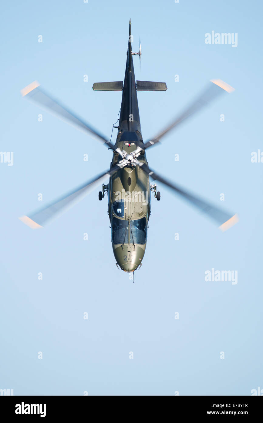 PAYERNE, SWITZERLAND - SEPTEMBER 6: Dynamic display of Agusta A-109 of Belgian Air Force during AIR14 airshow in Payerne Stock Photo