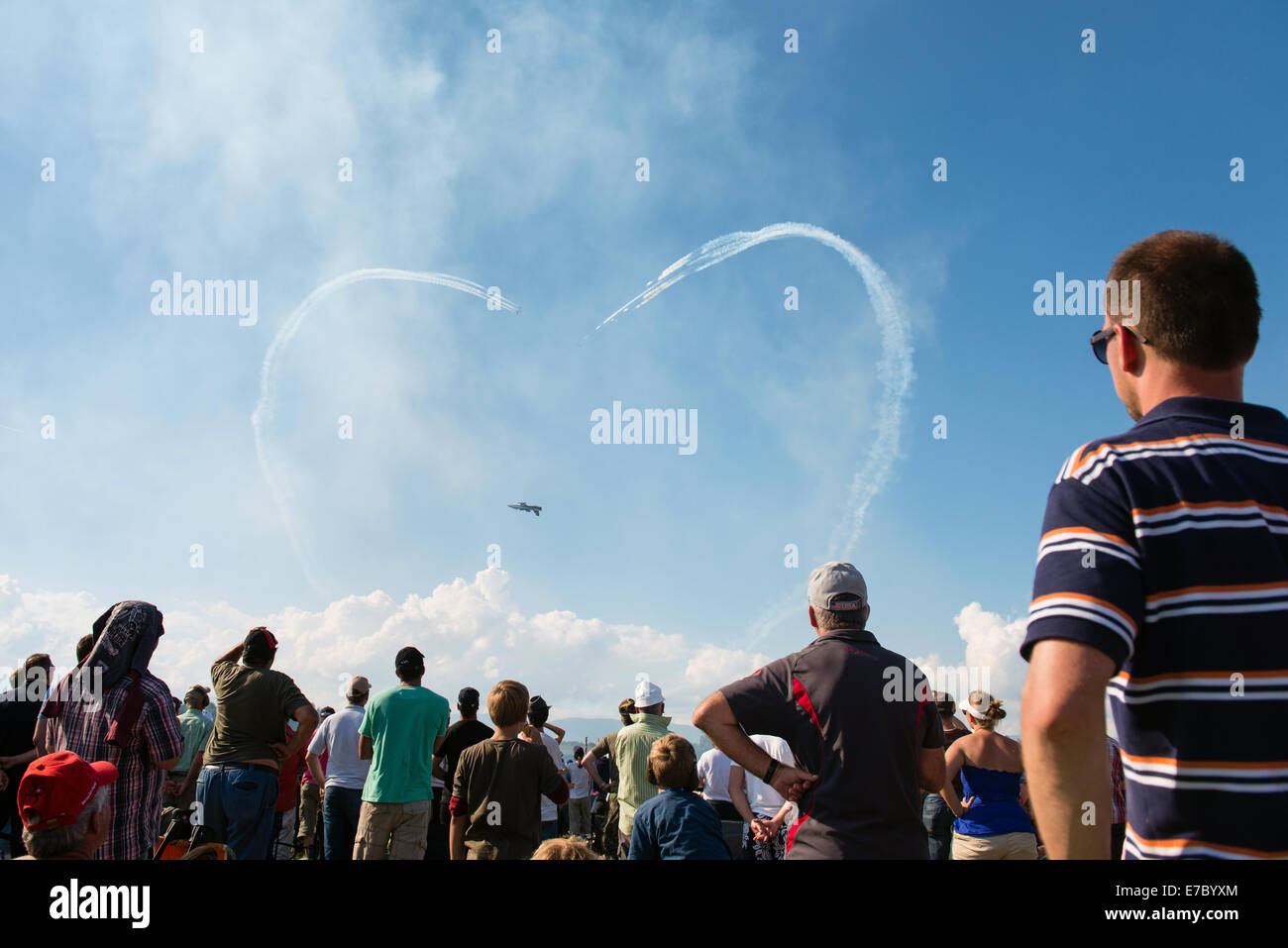 PAYERNE, SWITZERLAND - SEPTEMBER 6: Smoke from Frecce Tricolori jets create heart in the sky during AIR14 airshow in Payerne Stock Photo