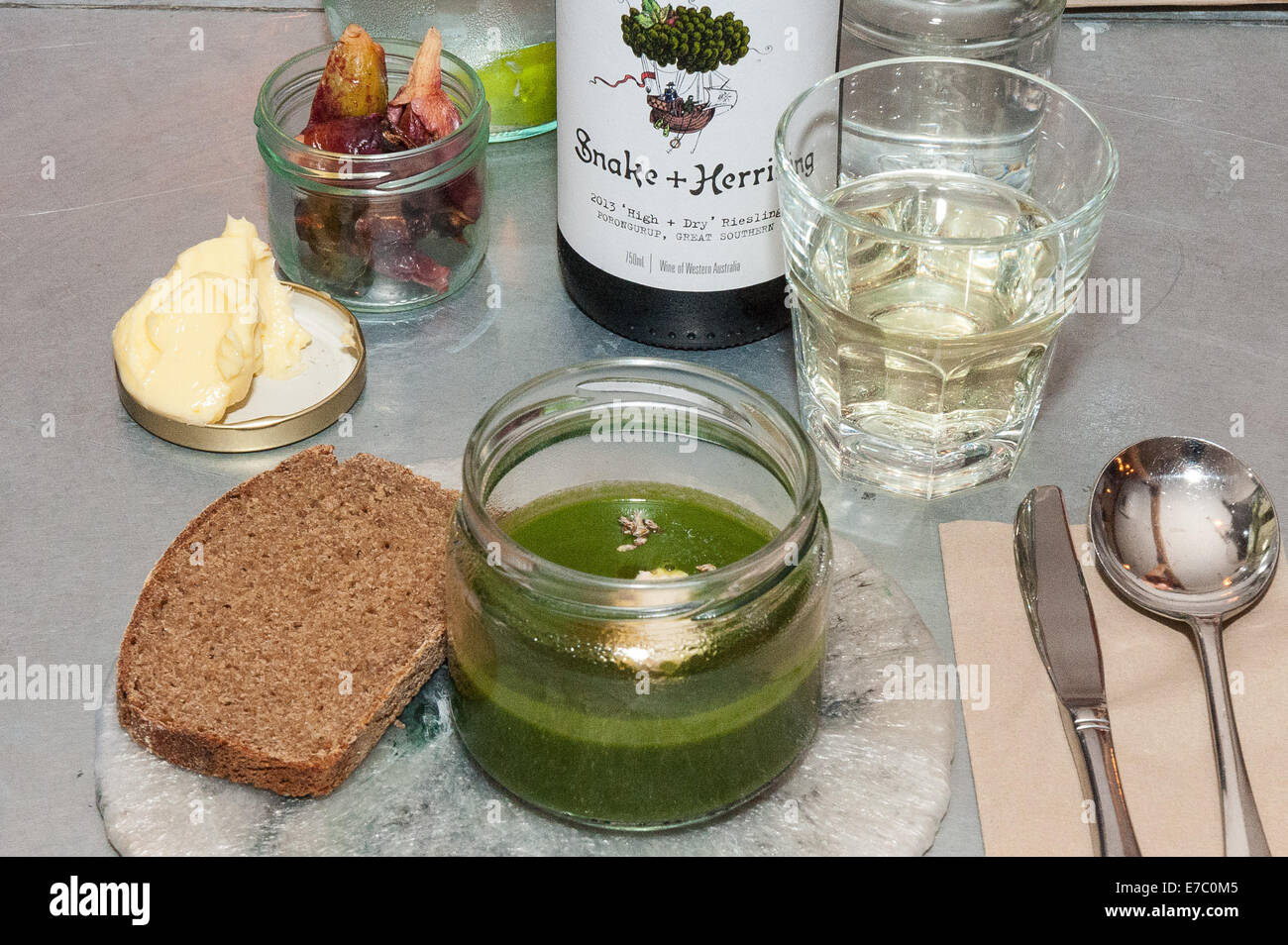 Brighton, UK. 12th Sep, 2014. Nettle soup, horseradish, mugwort accompanied by Snake and Herring High Dry Riesling, 2013. Brighton & Hove Food and Drink Festival presents A Taste of Western Australia at Silo. Australian influenced Chef Douglas McMaster and Australian chef Matt Stone serve a meal in conjunction with wines from Western Australia at the innovative new restaurant Silo. Credit:  Julia Claxton/Alamy Live News Stock Photo