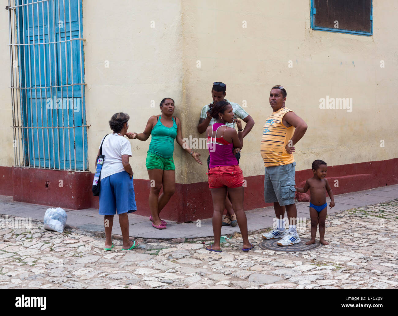 Cubans talking on street corner, Trinidad, Cuba Stock Photo